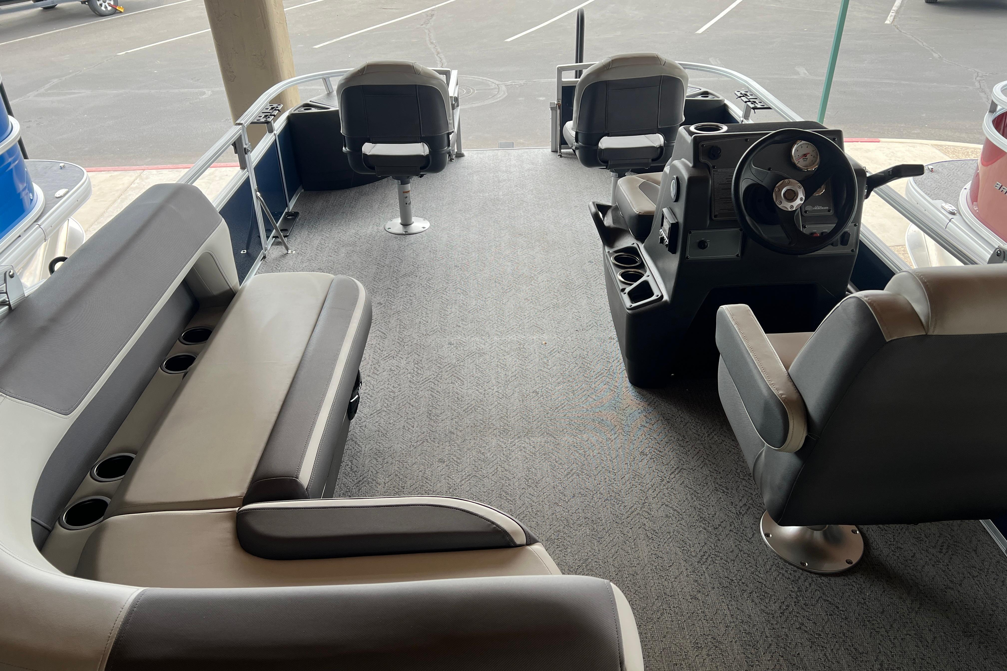 2026 Sun Tracker Bass Buggy 18 DLX interior with seating and steering console.