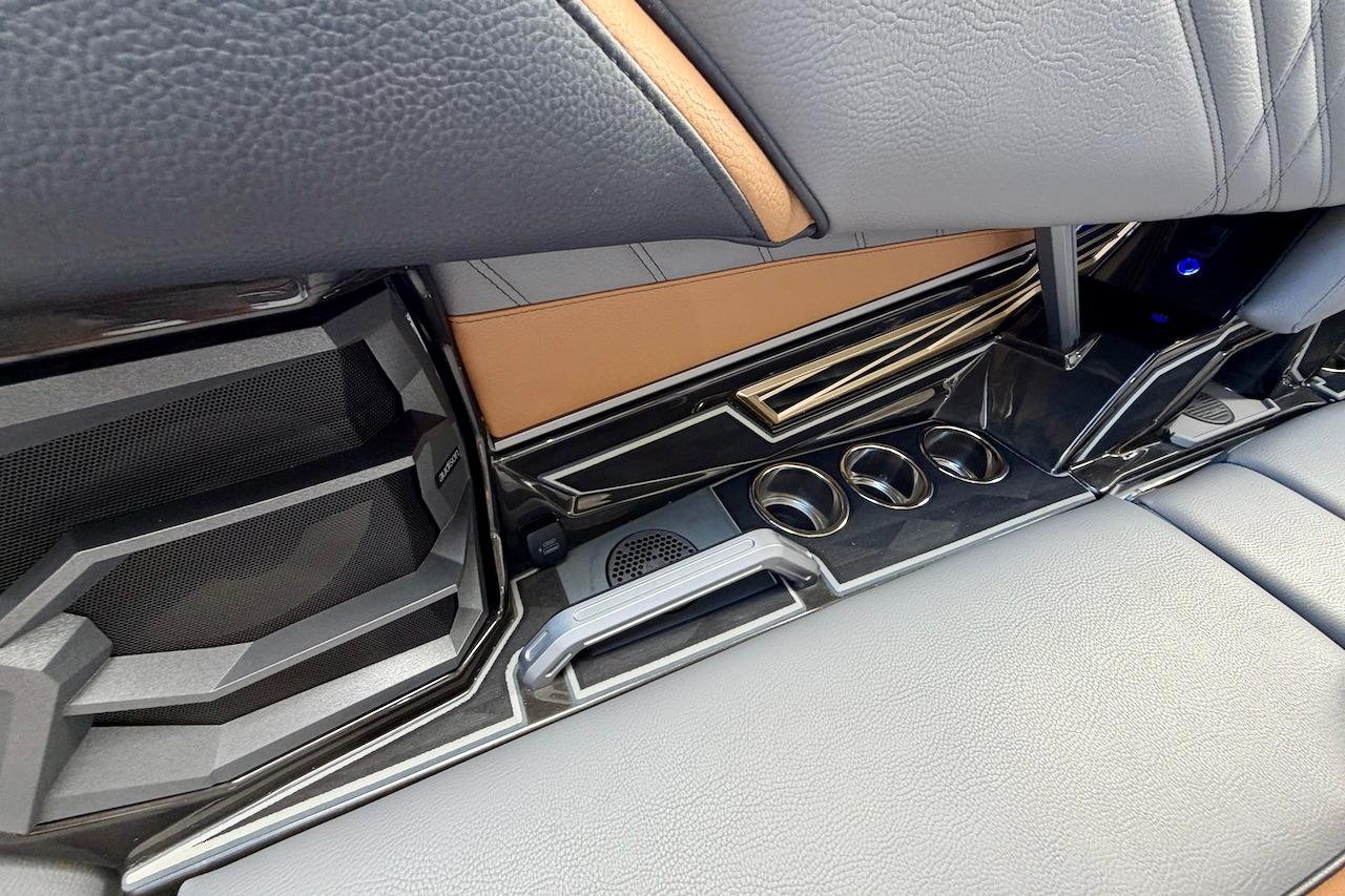 Interior of 2025 Tigé Ultré 25ZX boat featuring sleek design and cup holders.