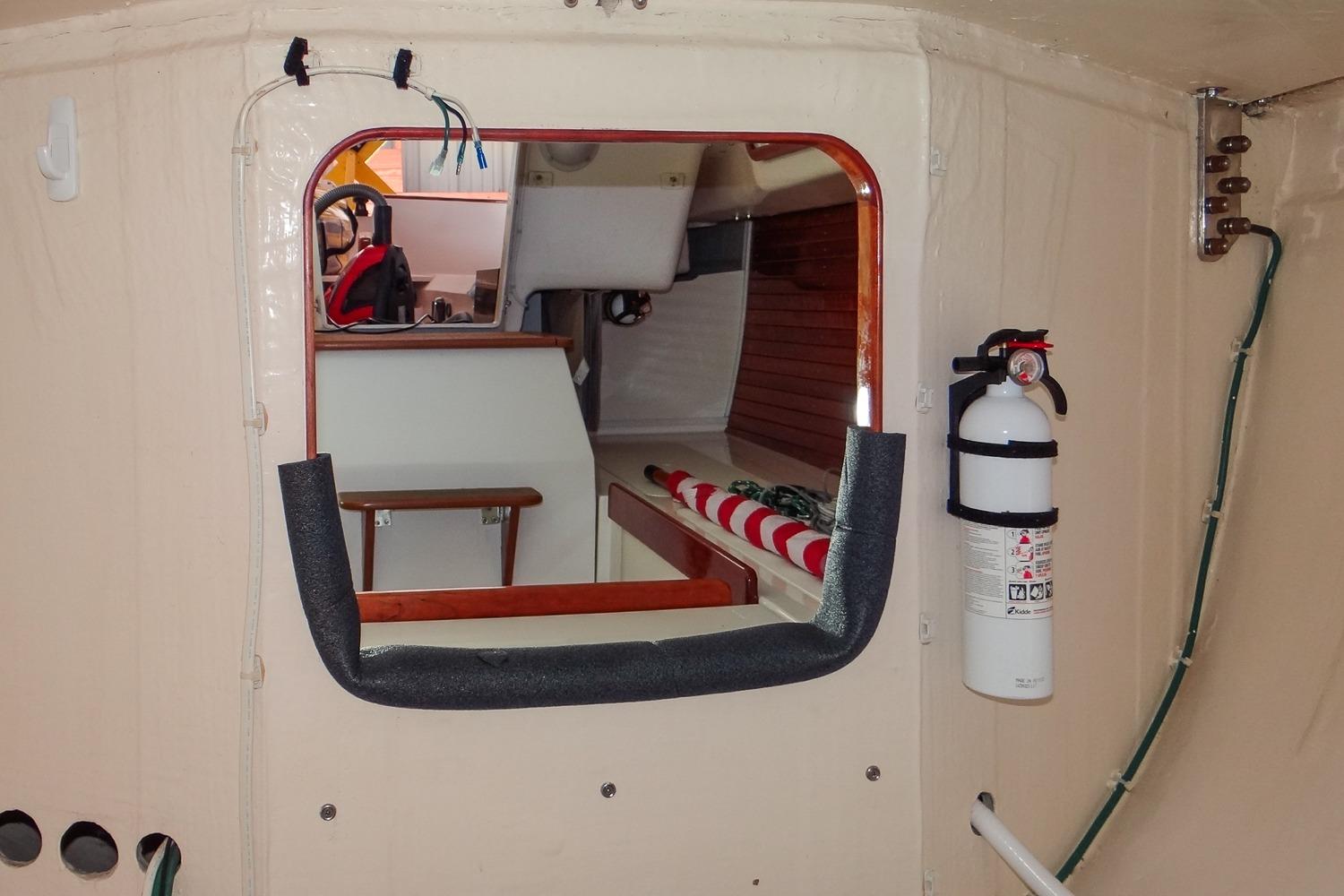 Interior view of 2012 Morris Yachts M29 sailboat, featuring a fire extinguisher and cabin details.