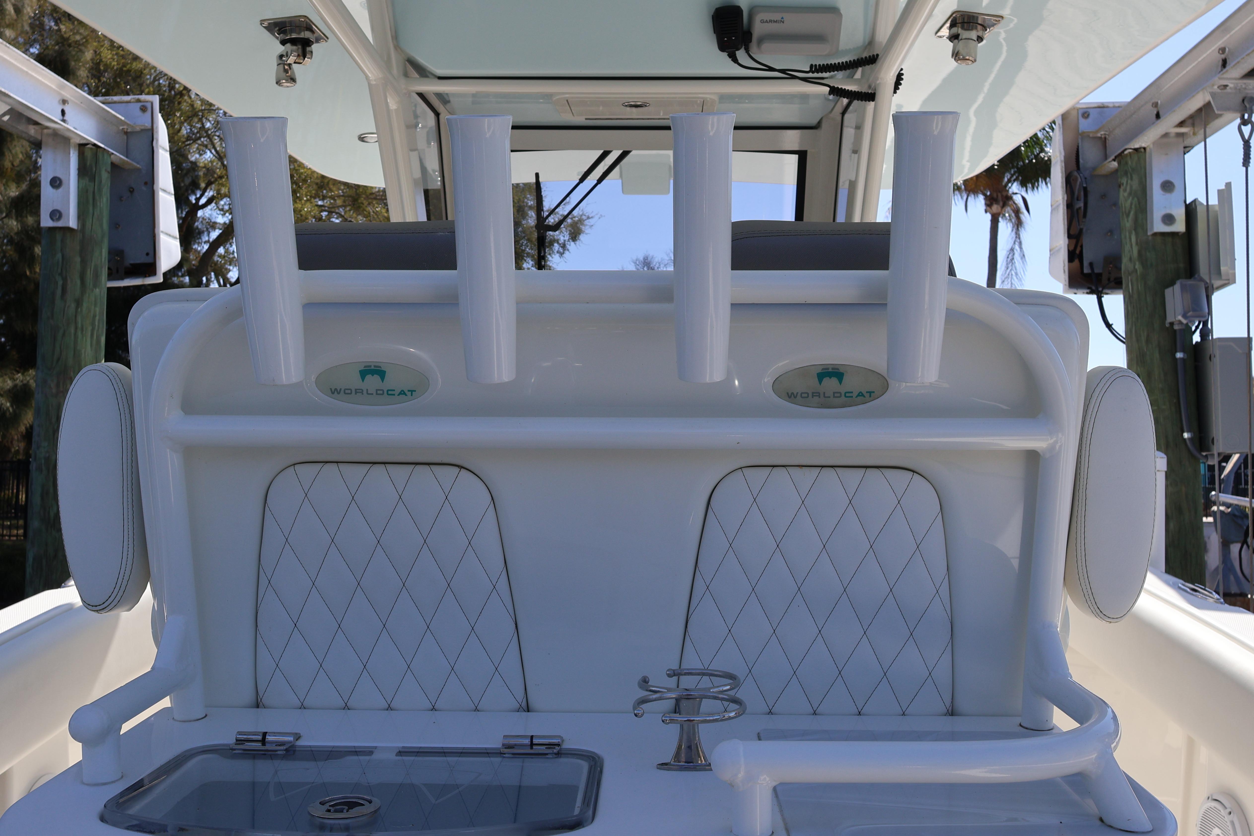 2022 World Cat 280 CC-X boat interior with rod holders and storage compartments.