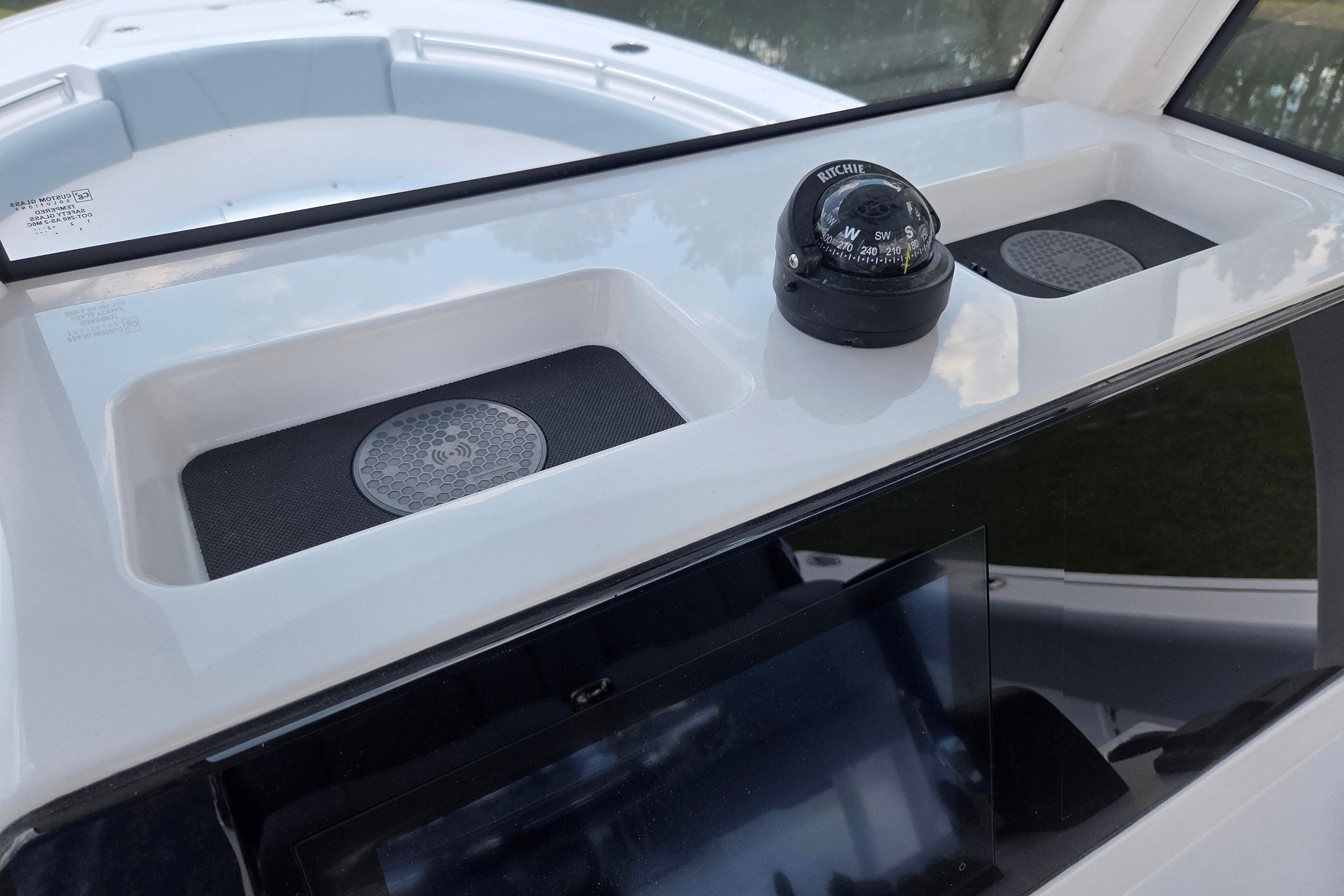 2026 Sportsman Open 212 Center Console dashboard with compass and storage compartments.