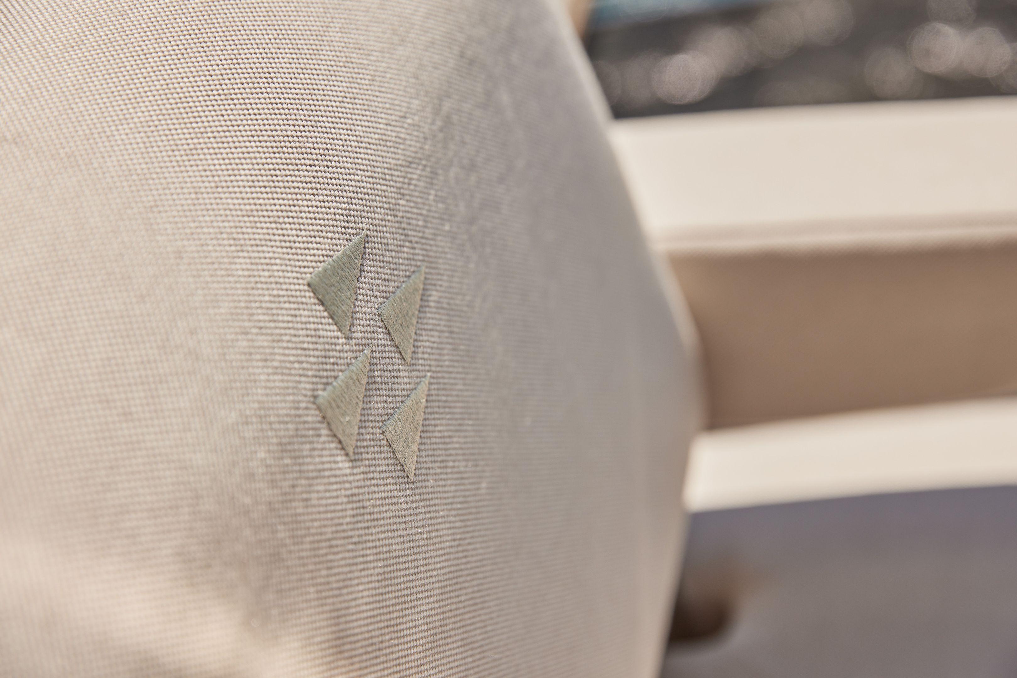 Close-up of Prestige X60 2026 yacht's beige fabric with triangular pattern.