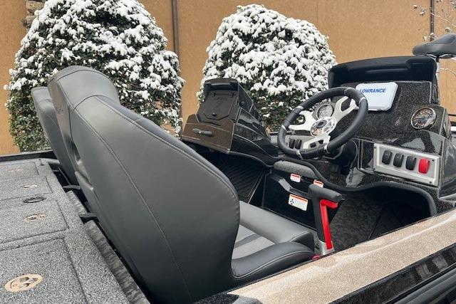 2026 Nitro Z19 XL boat interior with steering wheel and seats, snowy background.