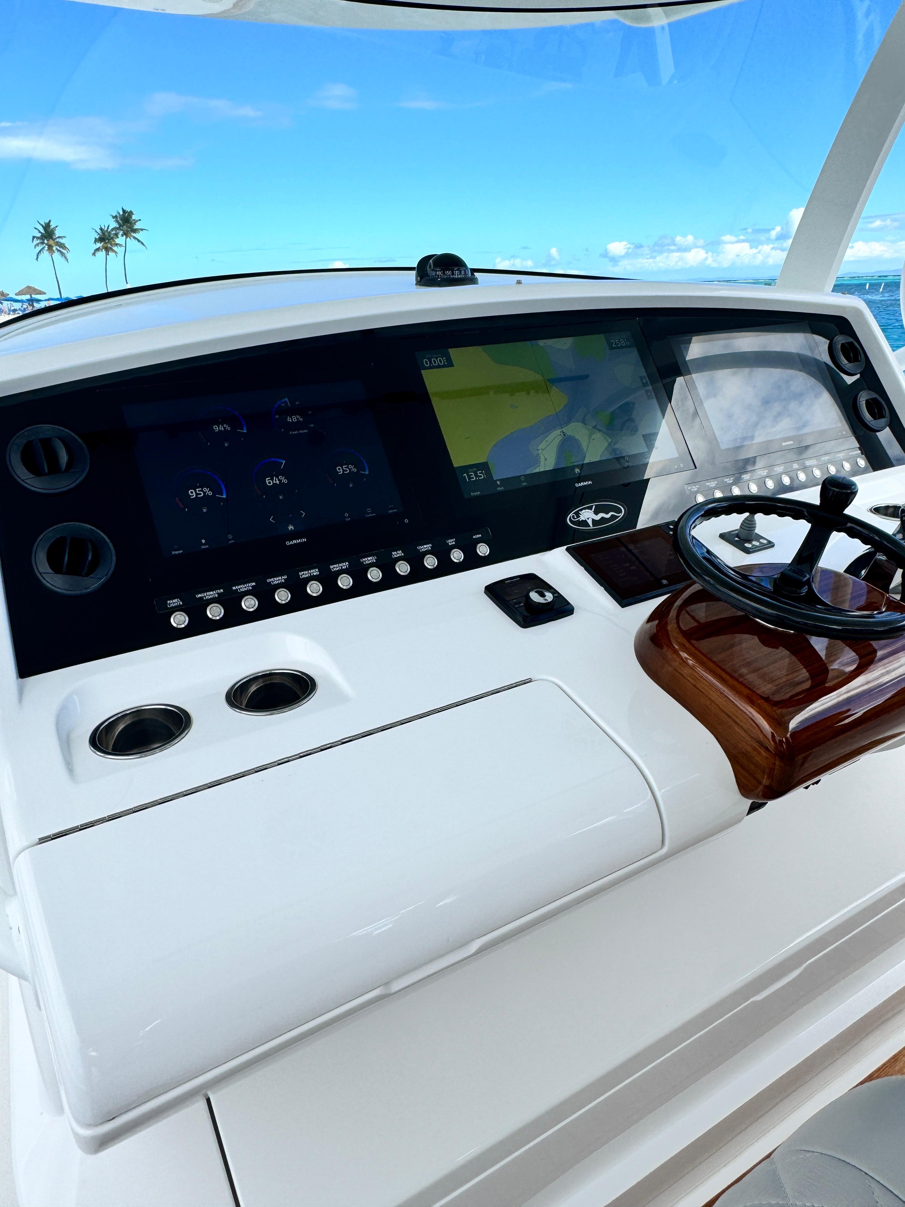 2023 Valhalla Boatworks V-46 helm with advanced navigation system and ocean view.