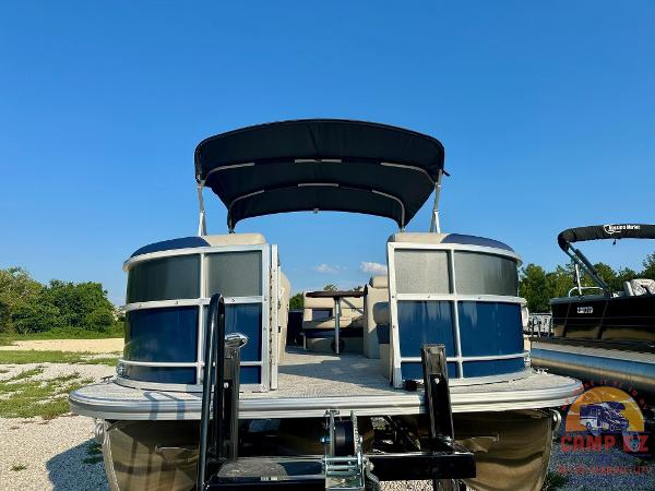 2025 South Bay 224FCR LE pontoon boat with canopy on trailer.