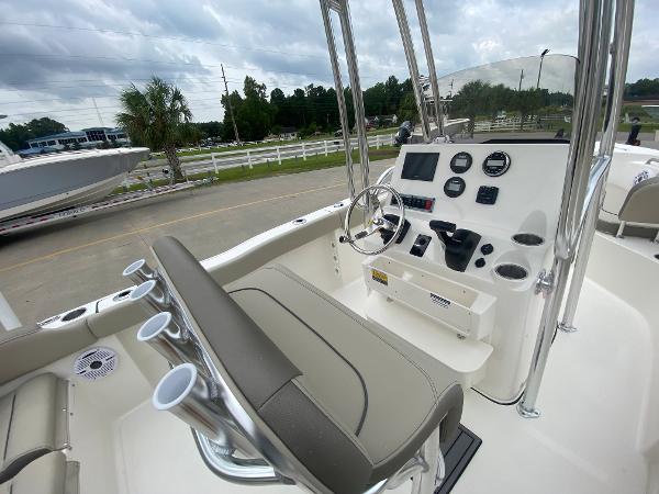 2024 Key West 203 FS boat interior with steering console and seating.