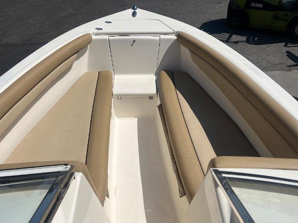 2019 Scout 210 Dorado boat with beige seating and white interior.