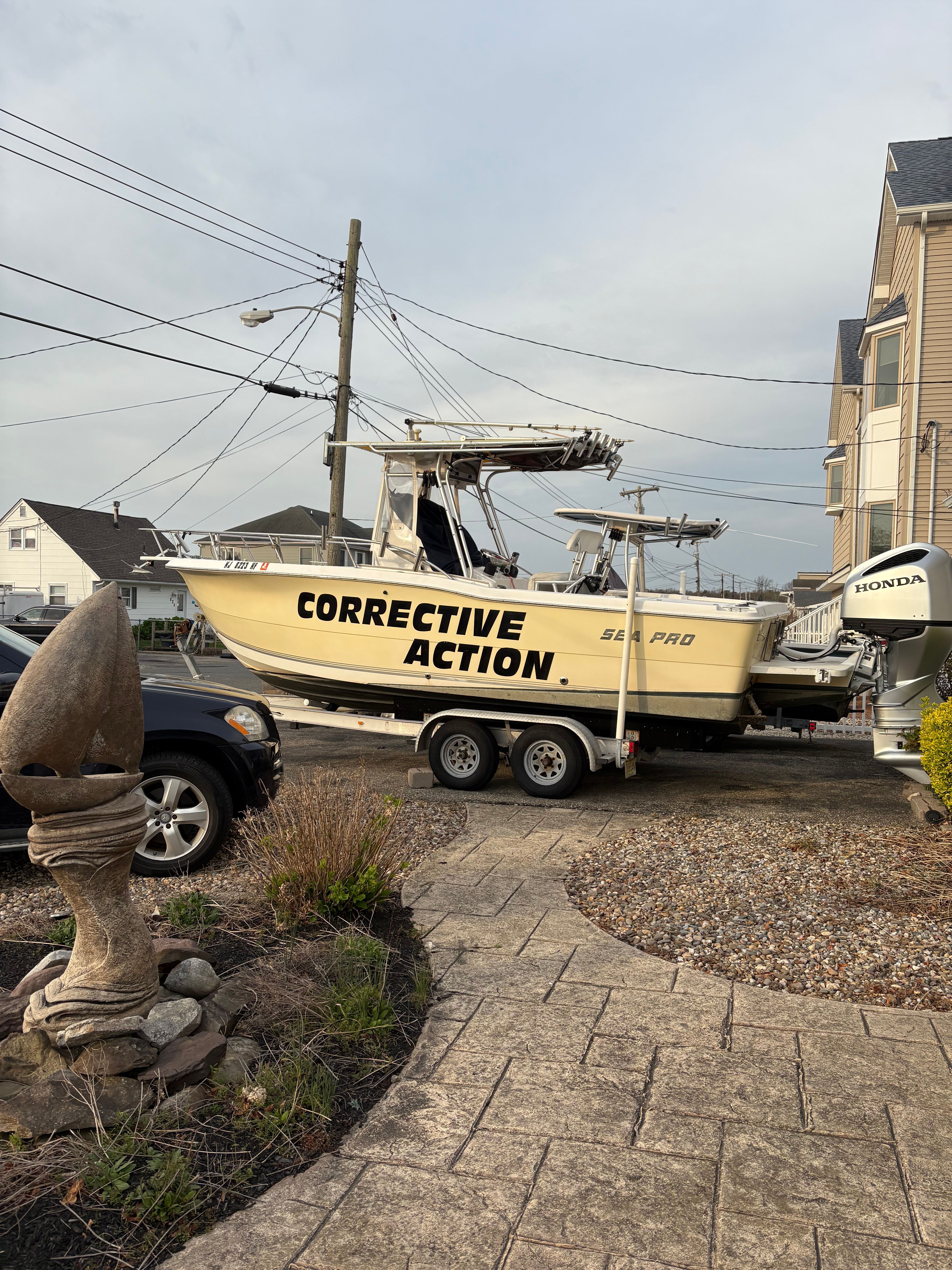 2003 Sea Pro 235 Center Console boat on trailer outdoors.