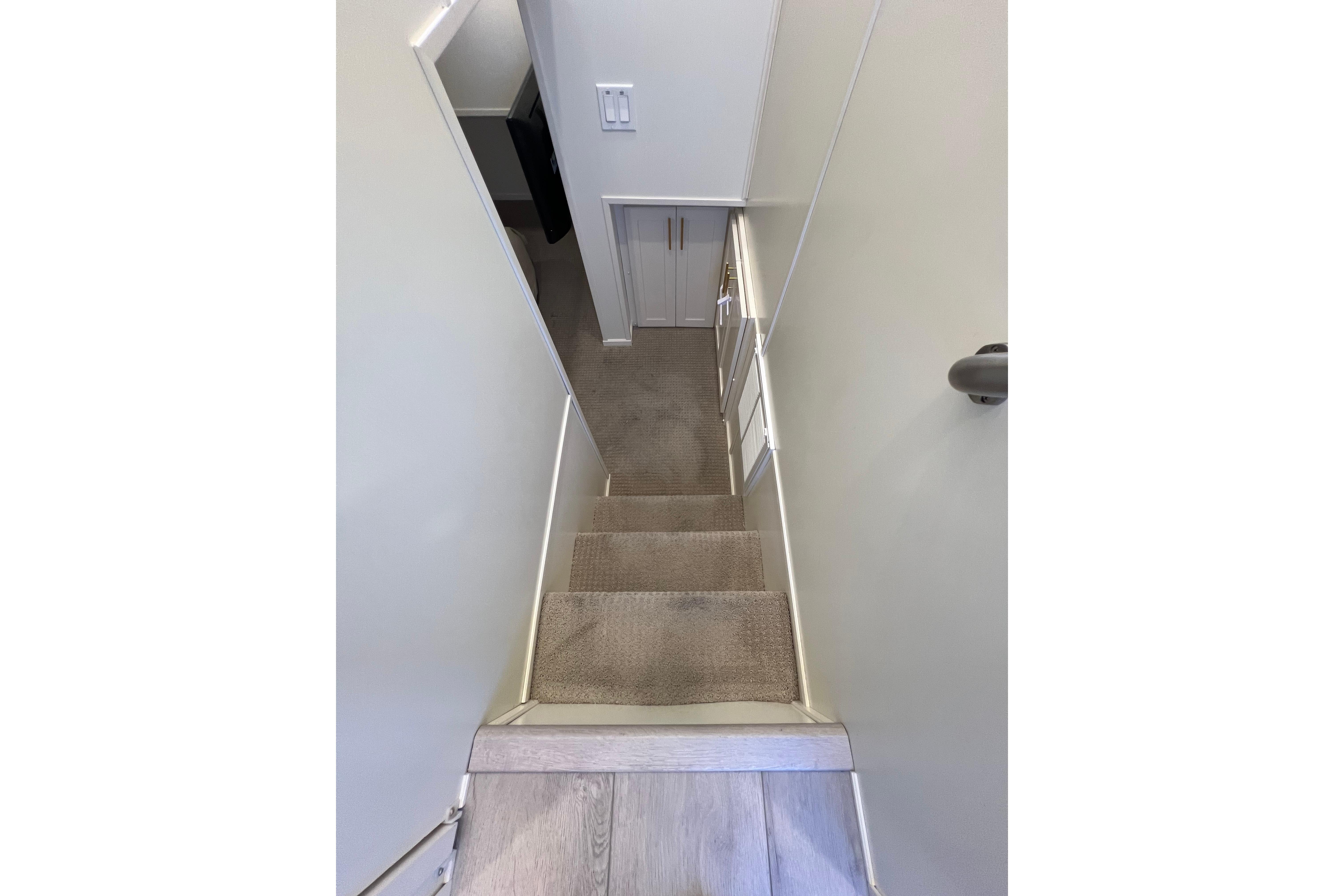 Staircase in 2025 Sumerset Excellence Multiple Shares houseboat interior.