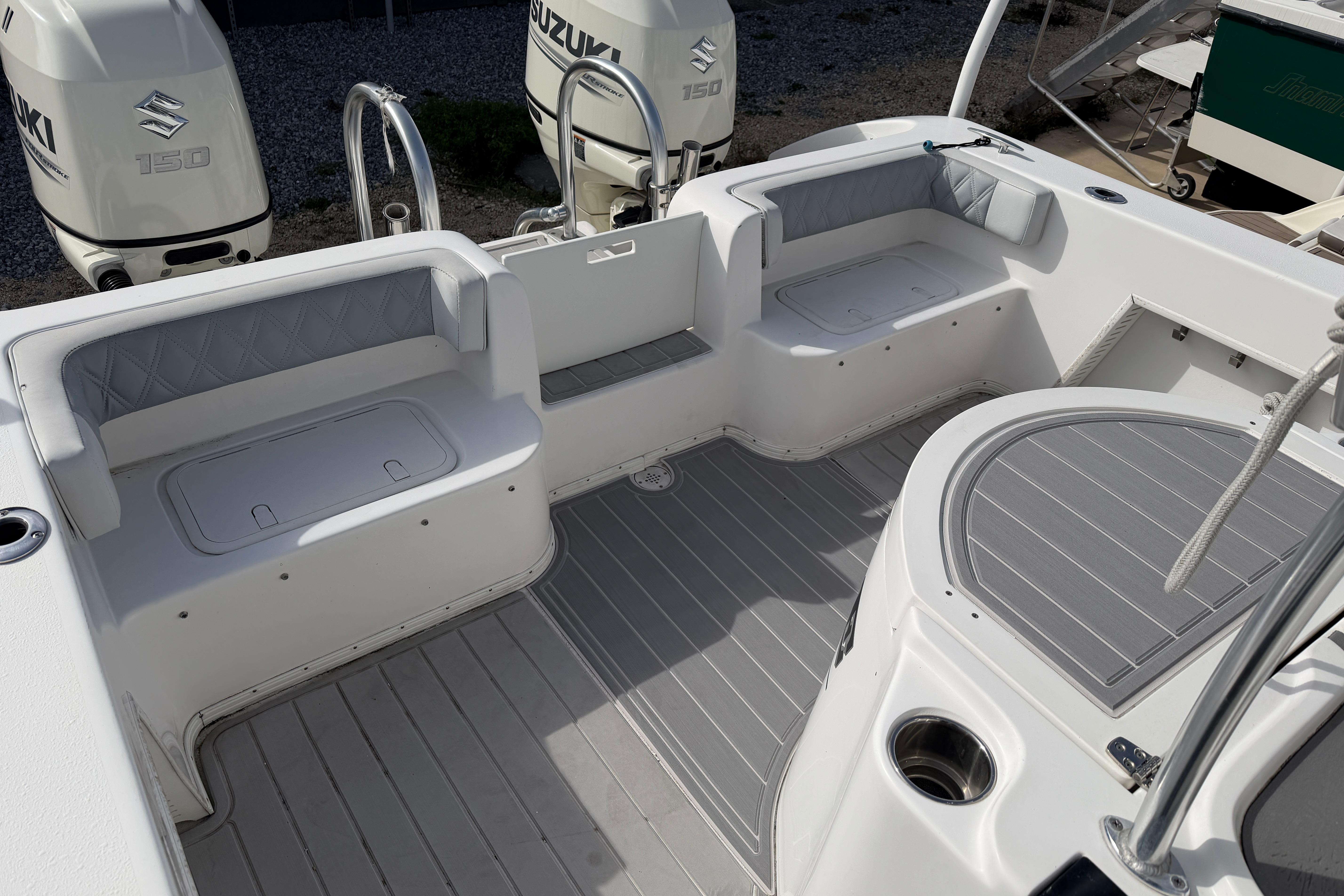 2018 Twin Vee 260 CC SE boat interior with seating and Suzuki engines.