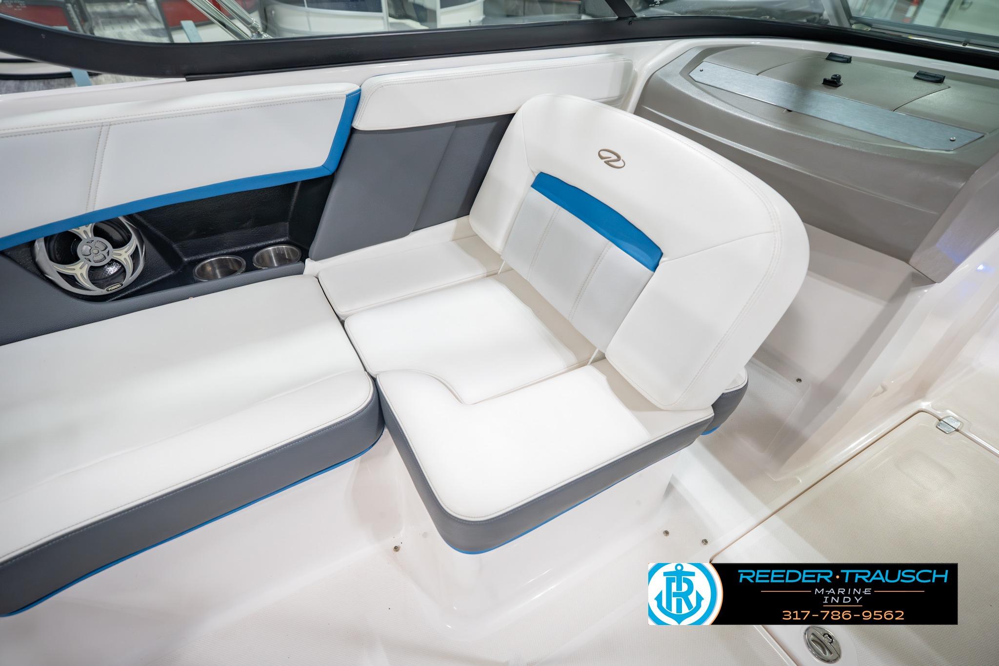 Interior of 2015 Regal 2000 ESX Bowrider with white and blue seating.