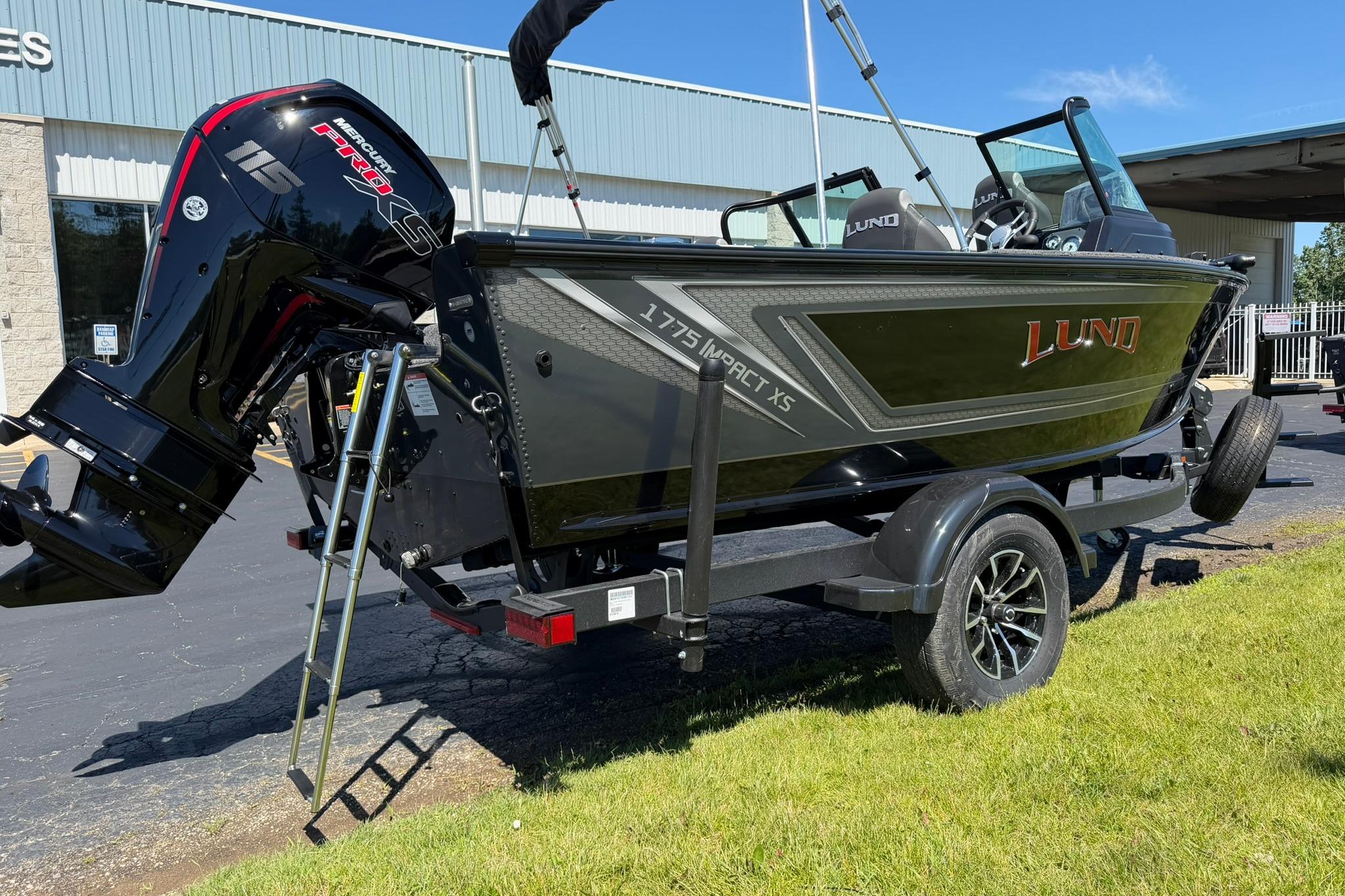 2027 Lund 1775 Impact XS Sport boat on trailer, featuring Mercury 115 Pro XS engine.