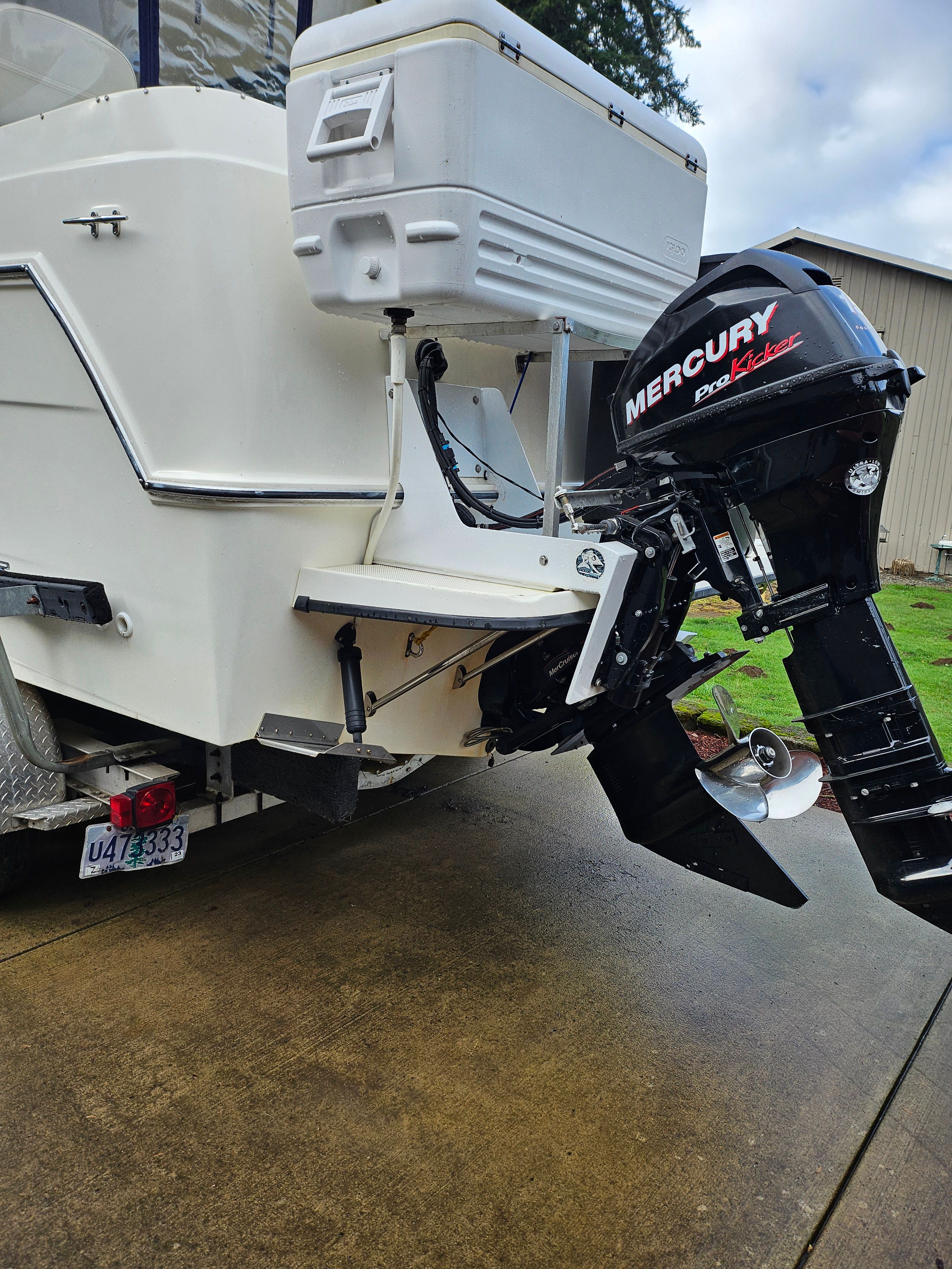 Rear view of a Bayliner 242 Ceara with a Mercury outboard motor.