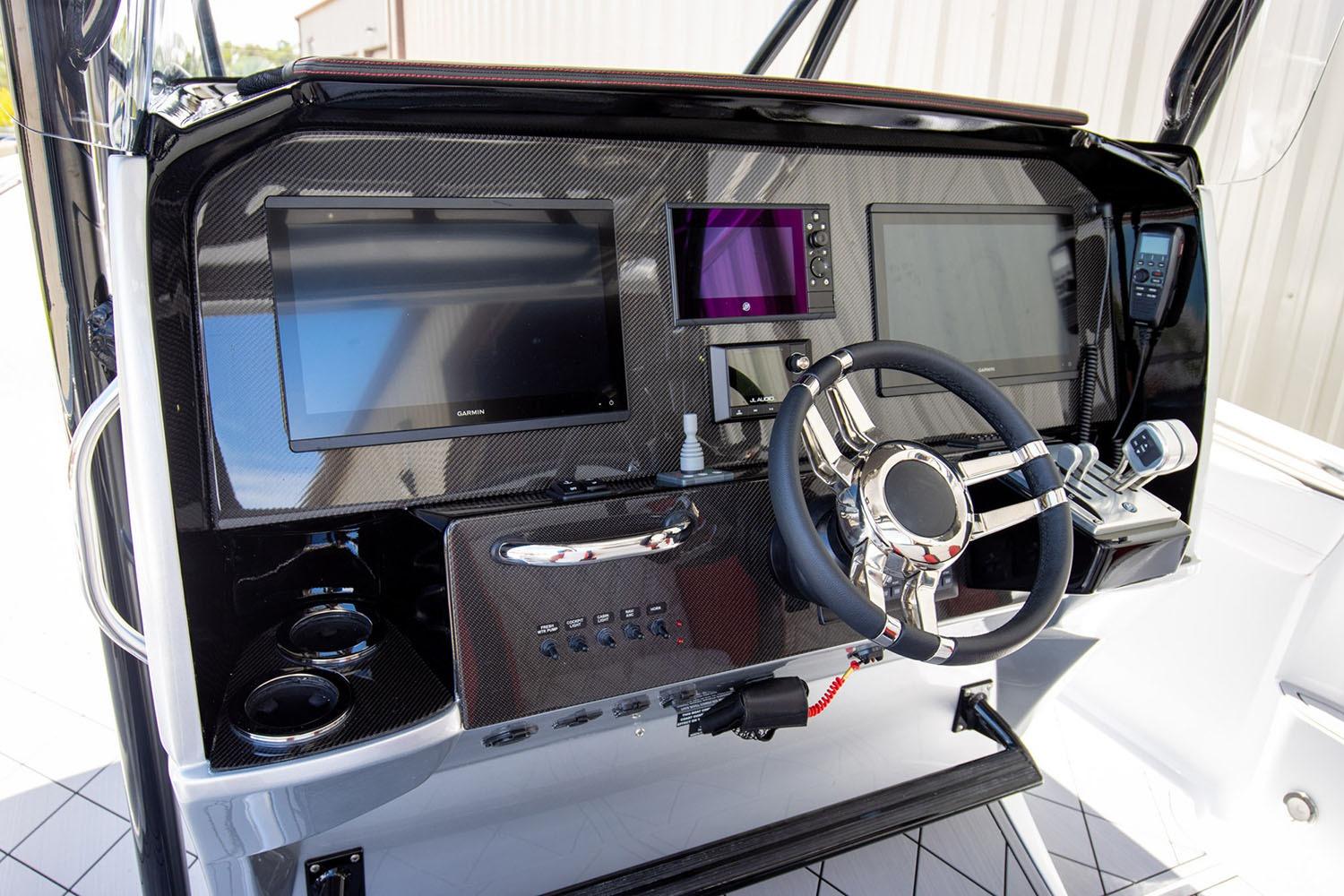 Manufacturer Provided Image: 2026 Nor-Tech 390 Sport Center Console dashboard with advanced navigation displays and steering wheel.