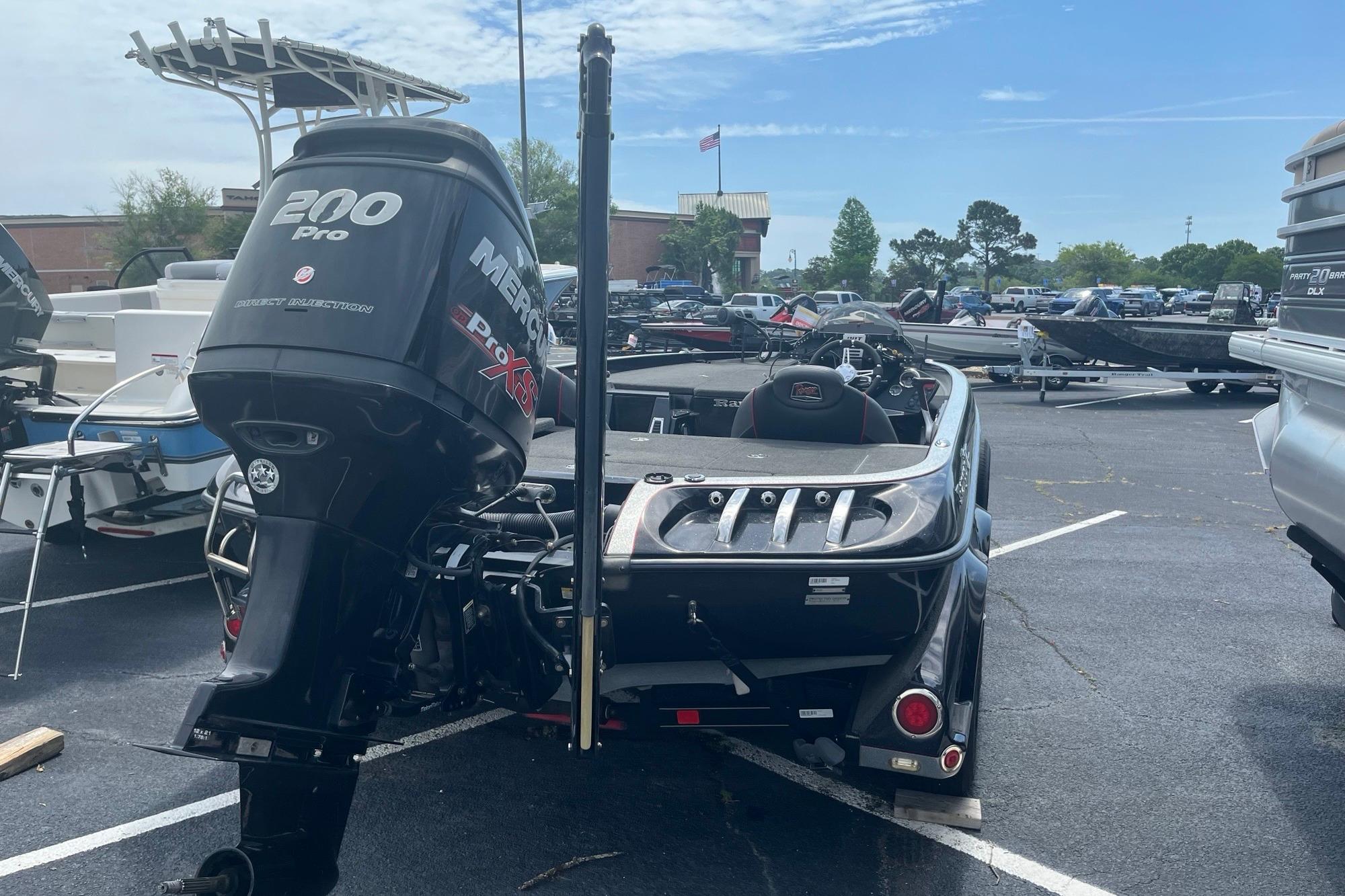 2017 Ranger Z518 Cup-Equipped boat with Mercury 200 Pro XS engine in parking lot.