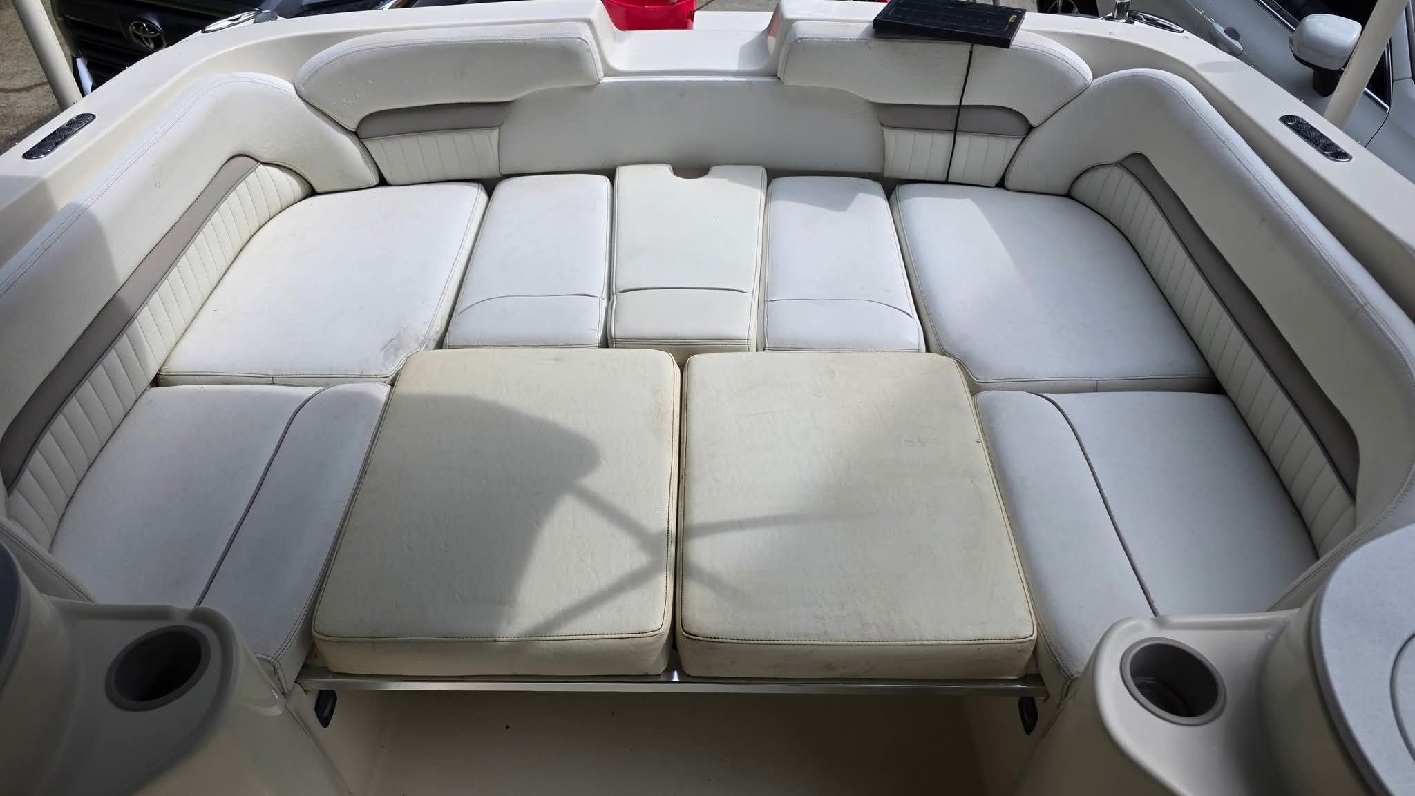 The image shows the spacious cockpit of a 2006 Stingray 250 CR with white upholstery.