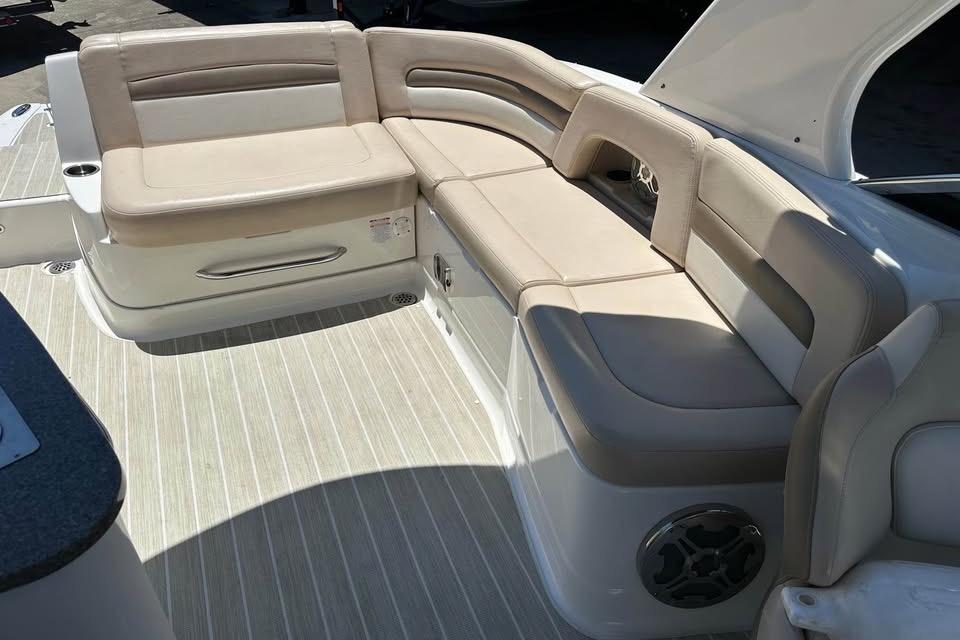 2012 Chaparral 284 Sunesta boat interior with beige seating and modern design.