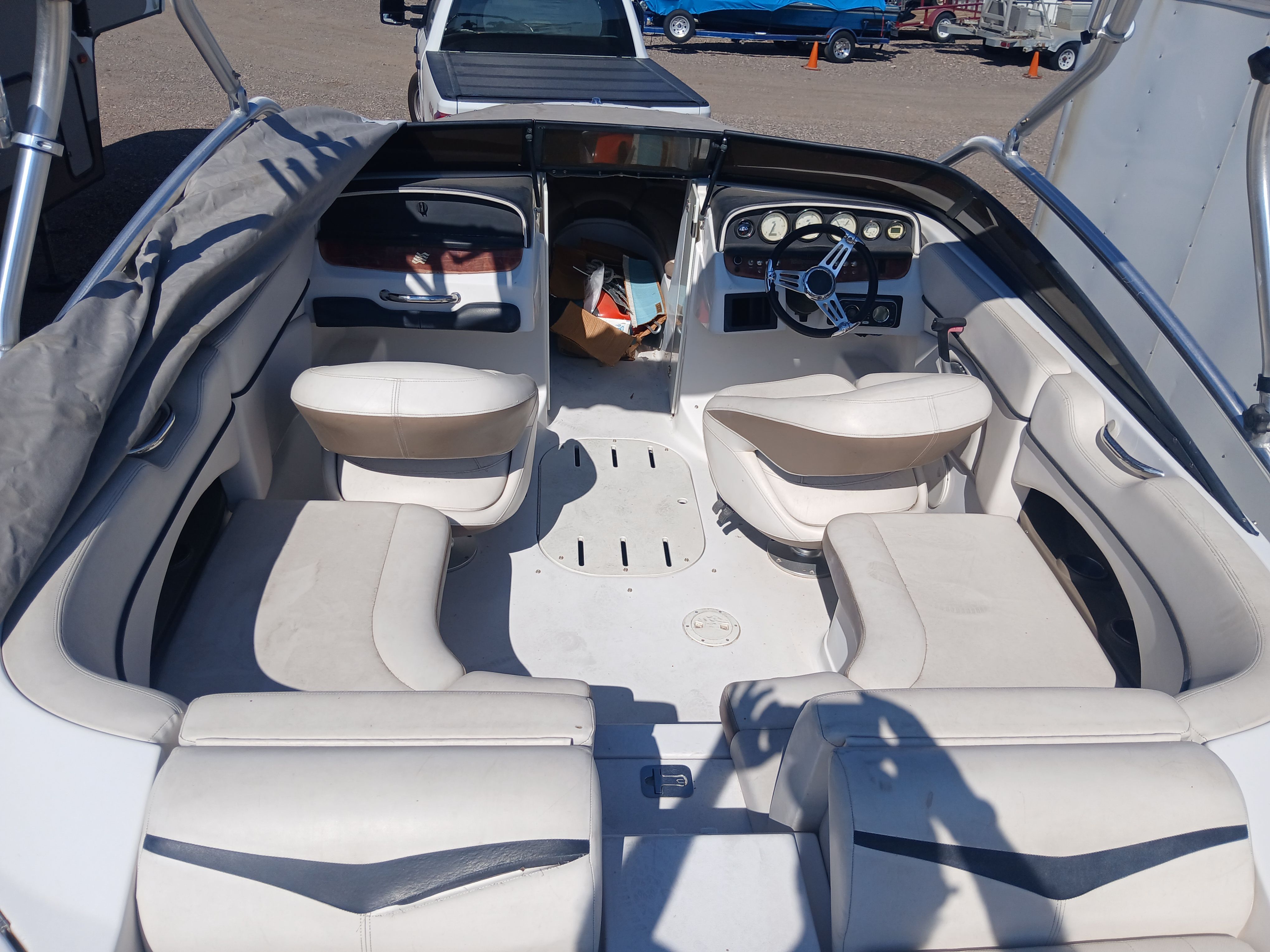Interior of a 2008 Four Winns H220SS boat with white seating.