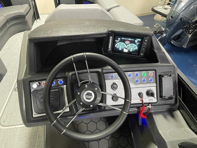 2026 South Bay 525 RS 3.0 Arch boat dashboard with steering wheel and control panel.