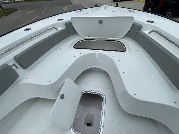 2026 Cape Horn 24XS boat interior with storage compartments and seating.