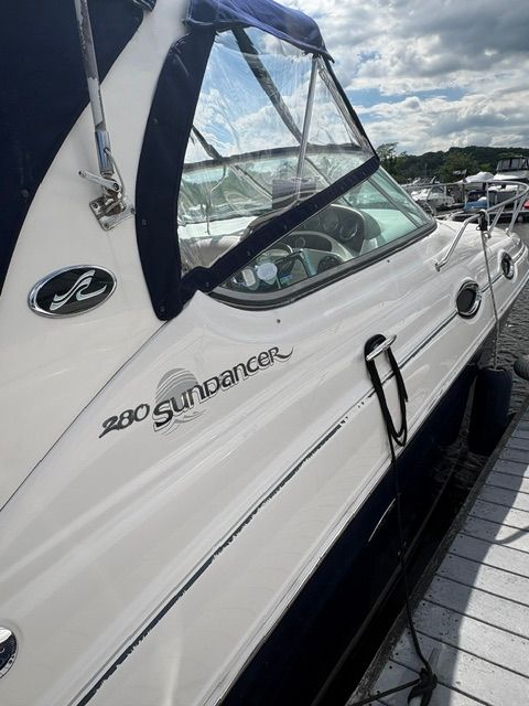 A 2005 Sea Ray Sundancer 280 docked. The boat features a sleek design.