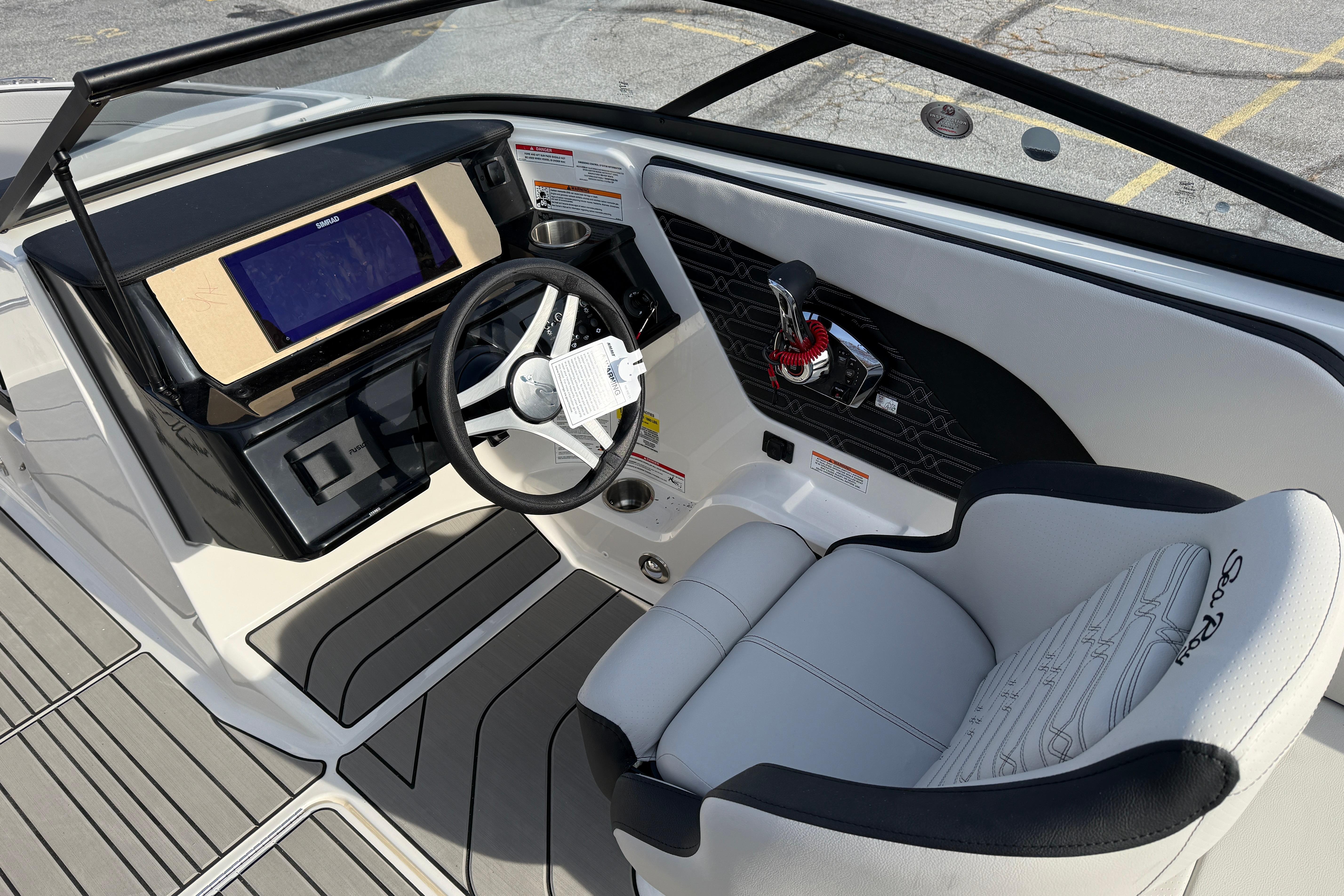 2026 Sea Ray SPX 210 Outboard boat interior with modern dashboard and steering wheel.