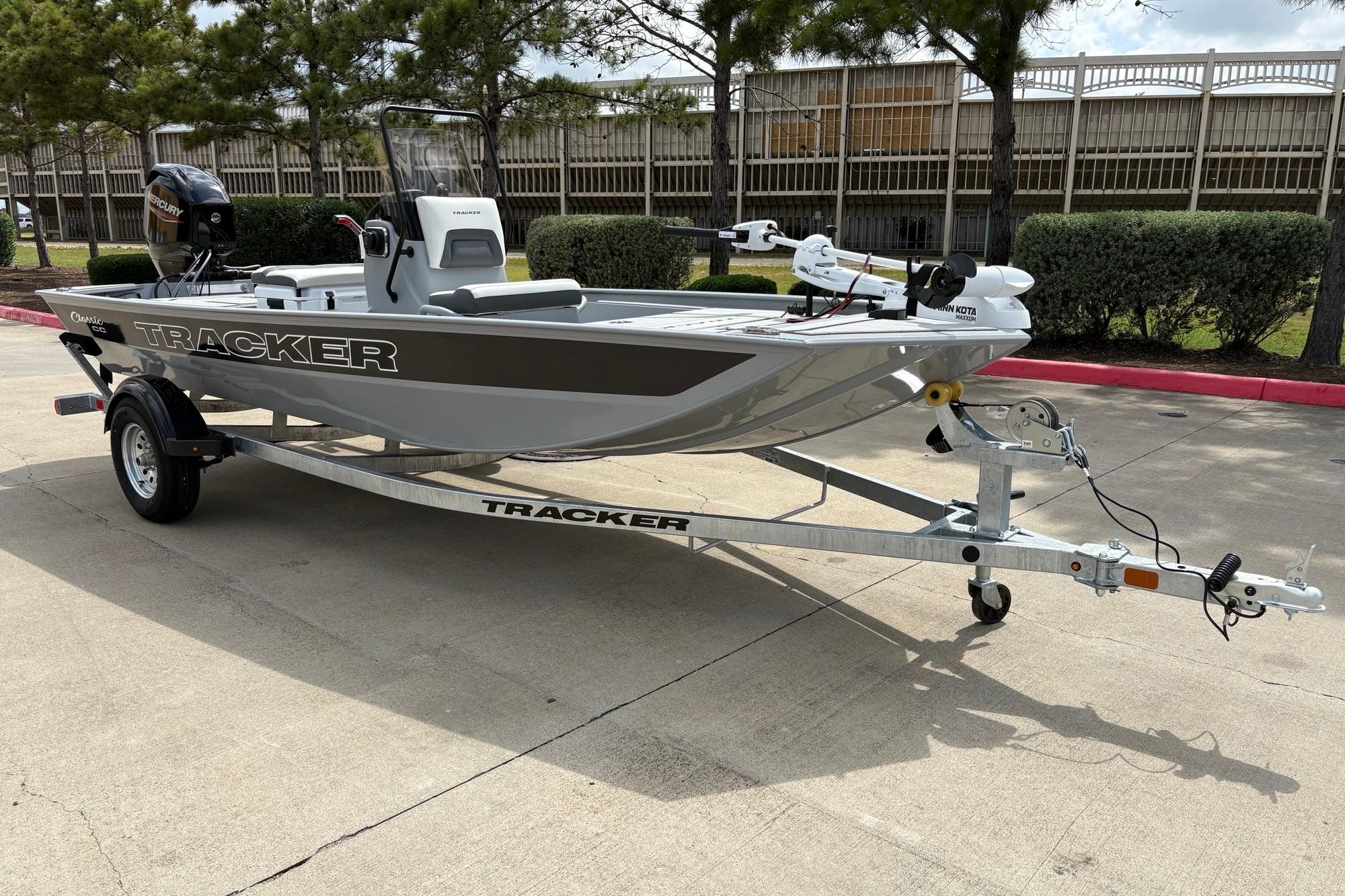 2026 Tracker Bass Tracker Classic CC boat on trailer, parked outdoors.