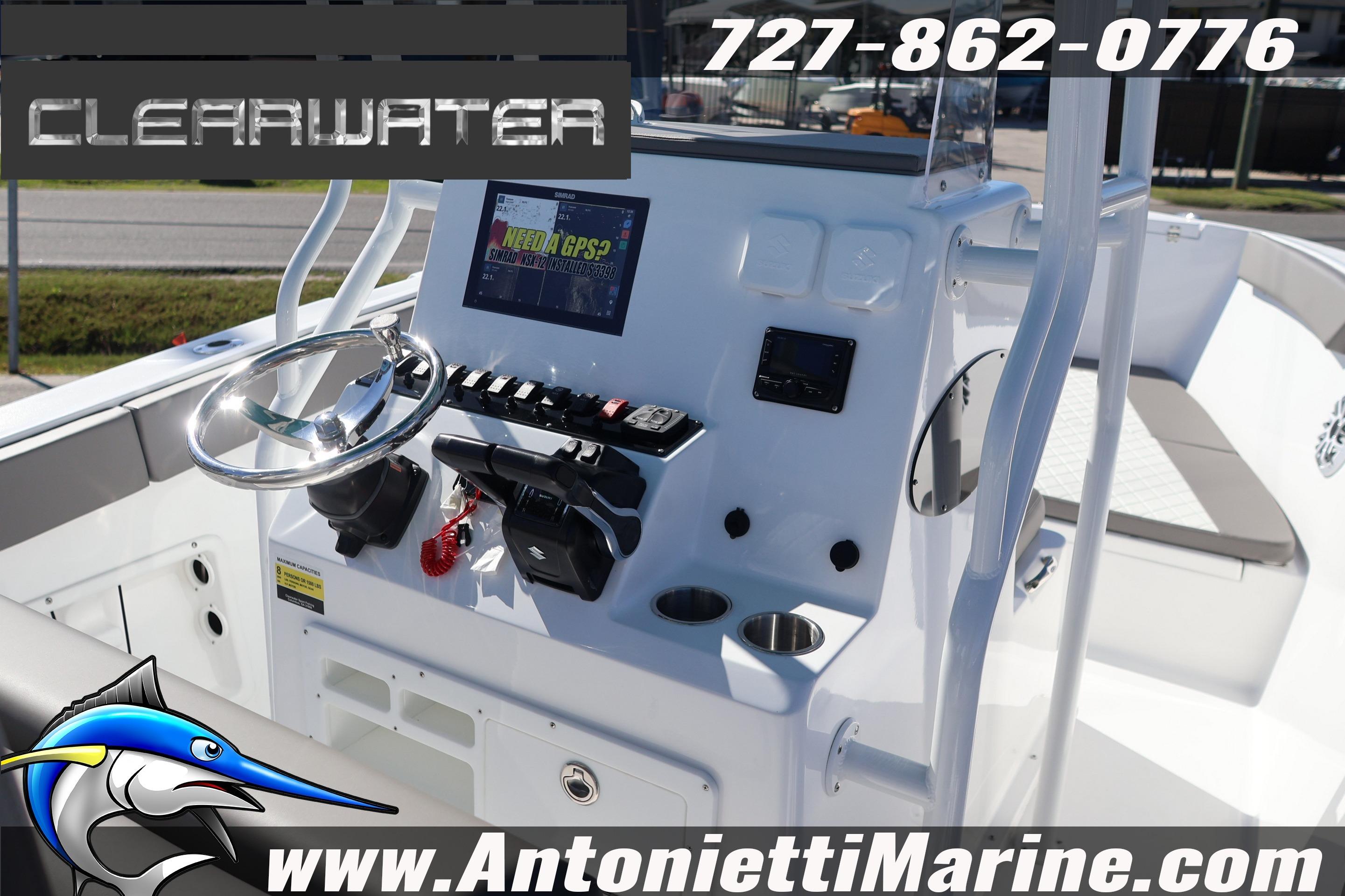 2026 Clearwater 2300 boat dashboard with GPS, steering wheel, and controls.