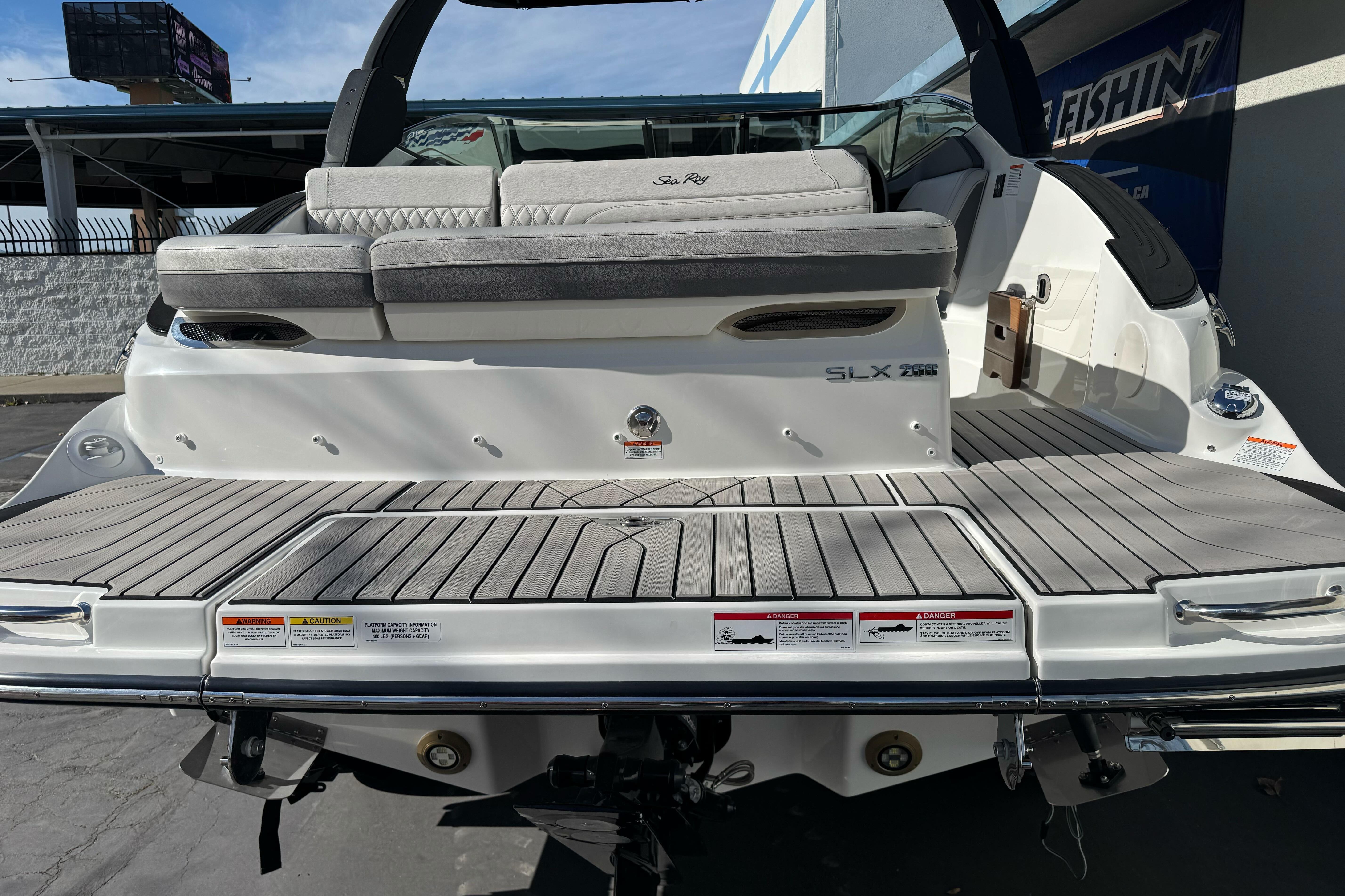 2026 Sea Ray SLX 260 boat rear view with spacious deck and seating.
