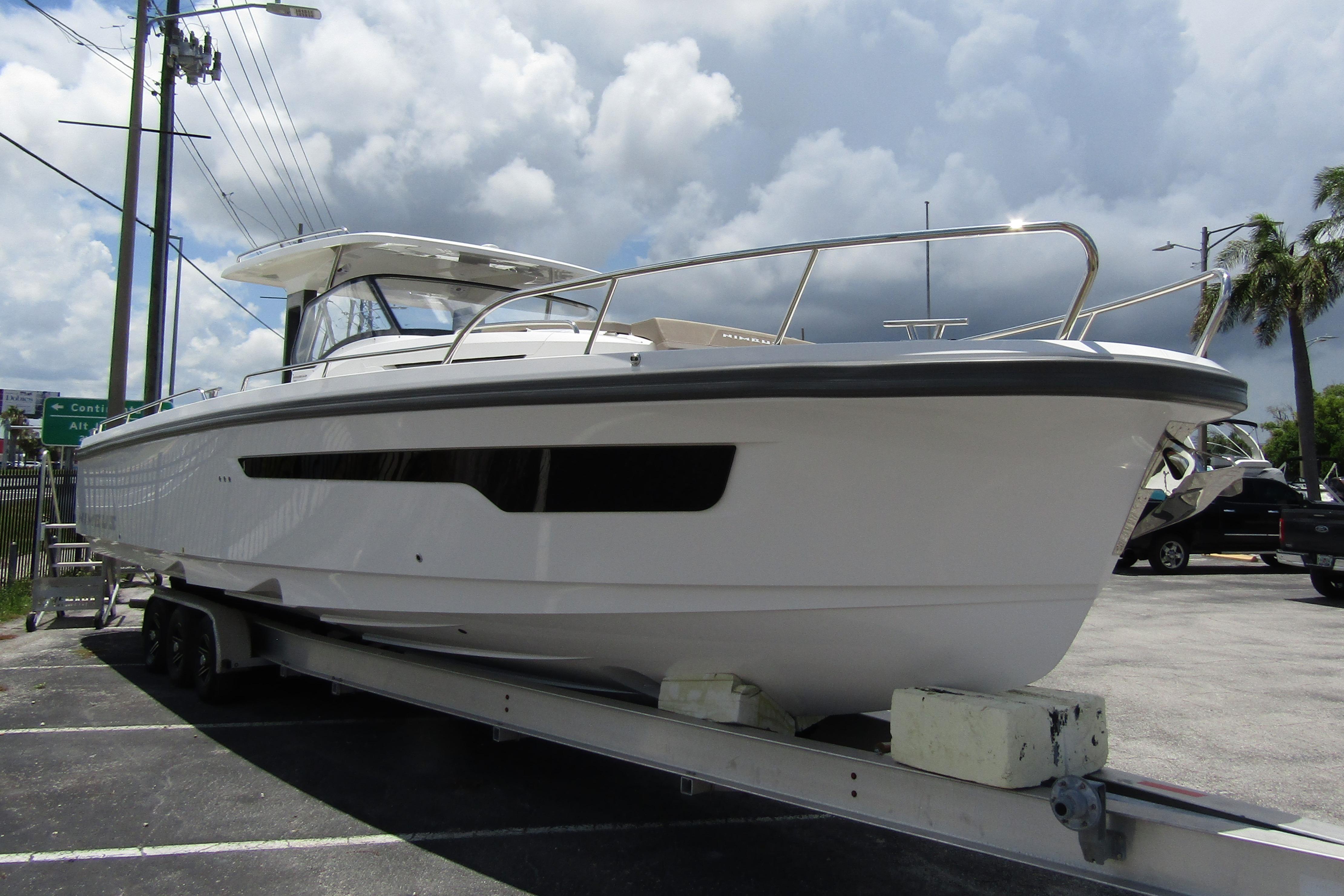 2025 Nimbus Tender 11 boat on trailer under cloudy sky.