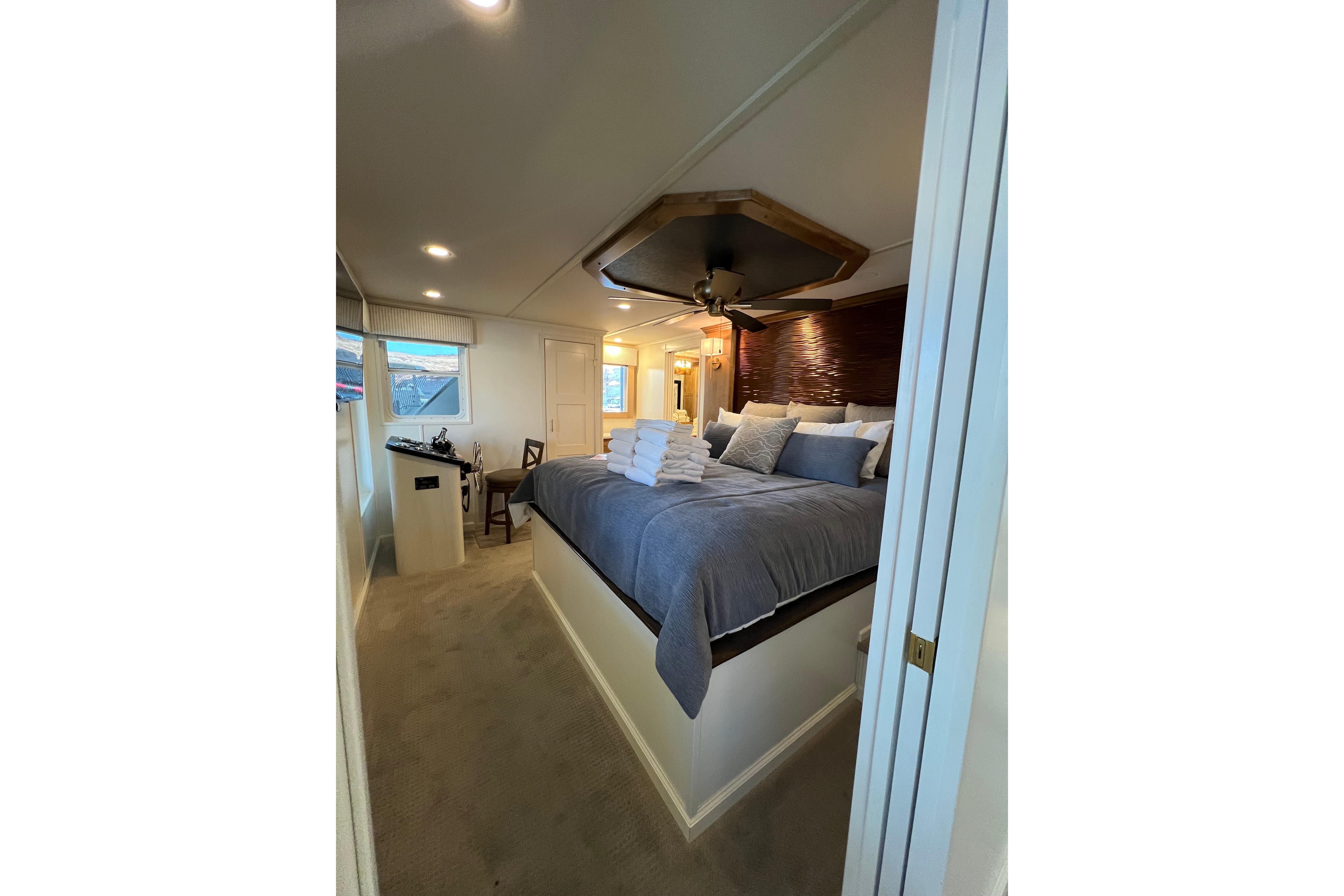 Luxurious bedroom interior on 2025 Sumerset Excellence Multiple Shares houseboat.