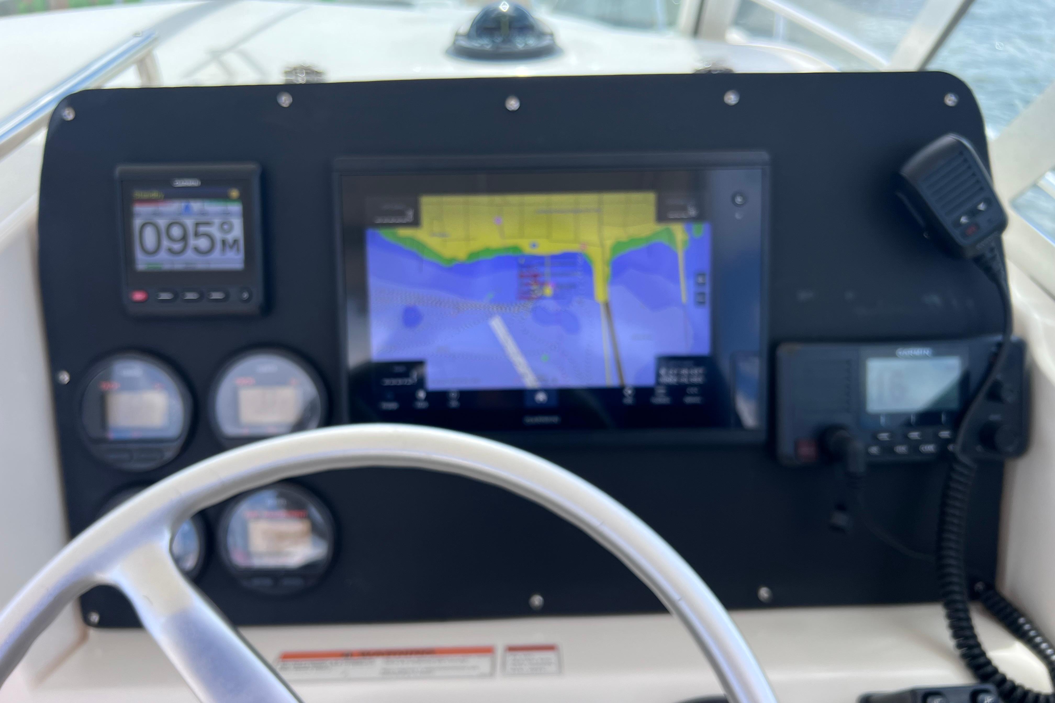 Dashboard of a 2004 Pursuit 2870 Walkaround boat with navigation equipment.