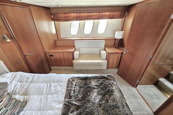 Luxurious cabin interior of 2005 Sunseeker Manhattan 66 yacht with plush seating and elegant decor.