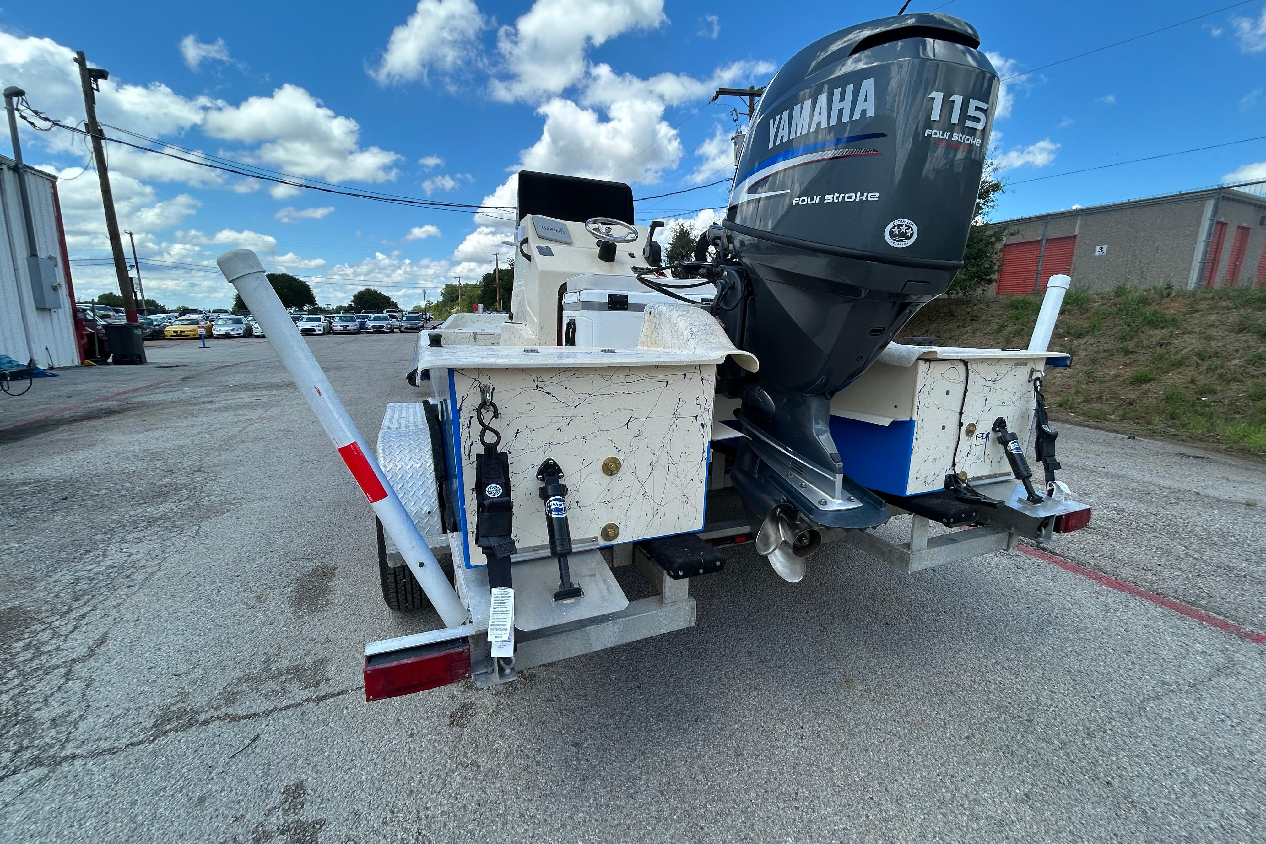 2007 Flats Cat 19 boat with Yamaha 115 engine on a trailer.