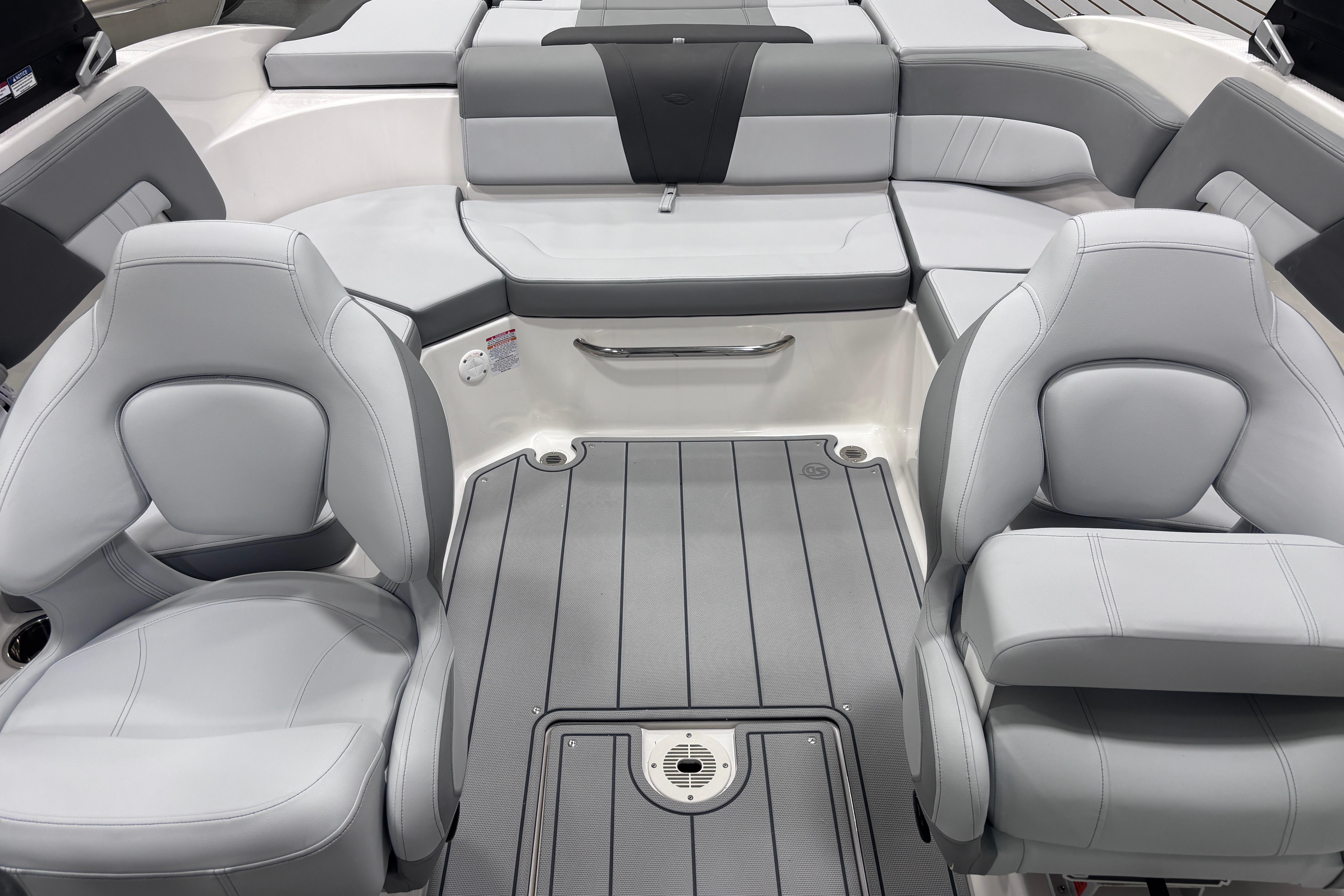 Interior of 2026 Chaparral 23 SSi boat with gray seating and flooring.