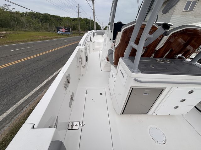 Edgewater 285CC Center Console 2026 parked on roadside.
