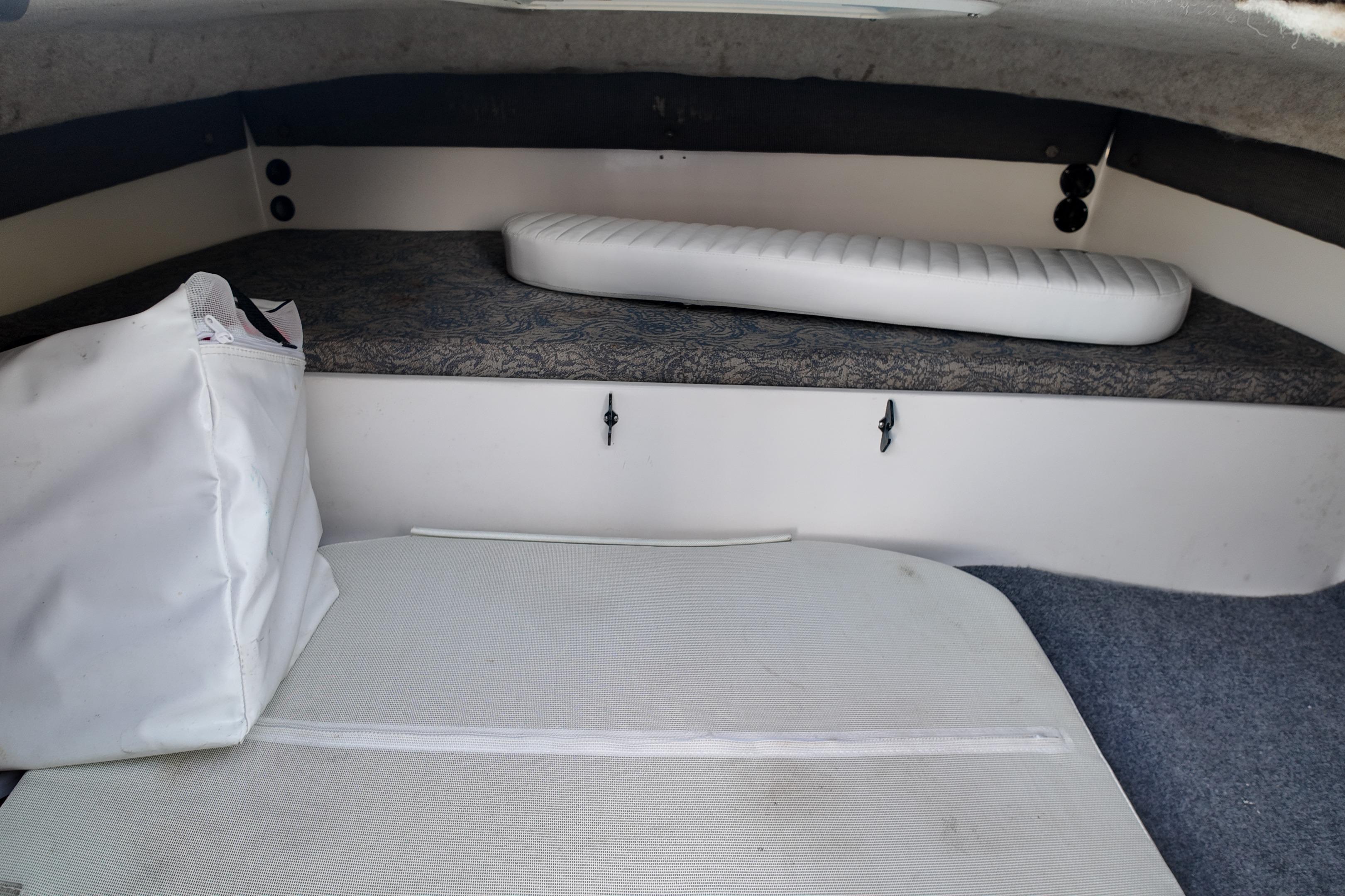 2003 Pro Sports 2860 SC ProKat cabin interior with cushions and storage.