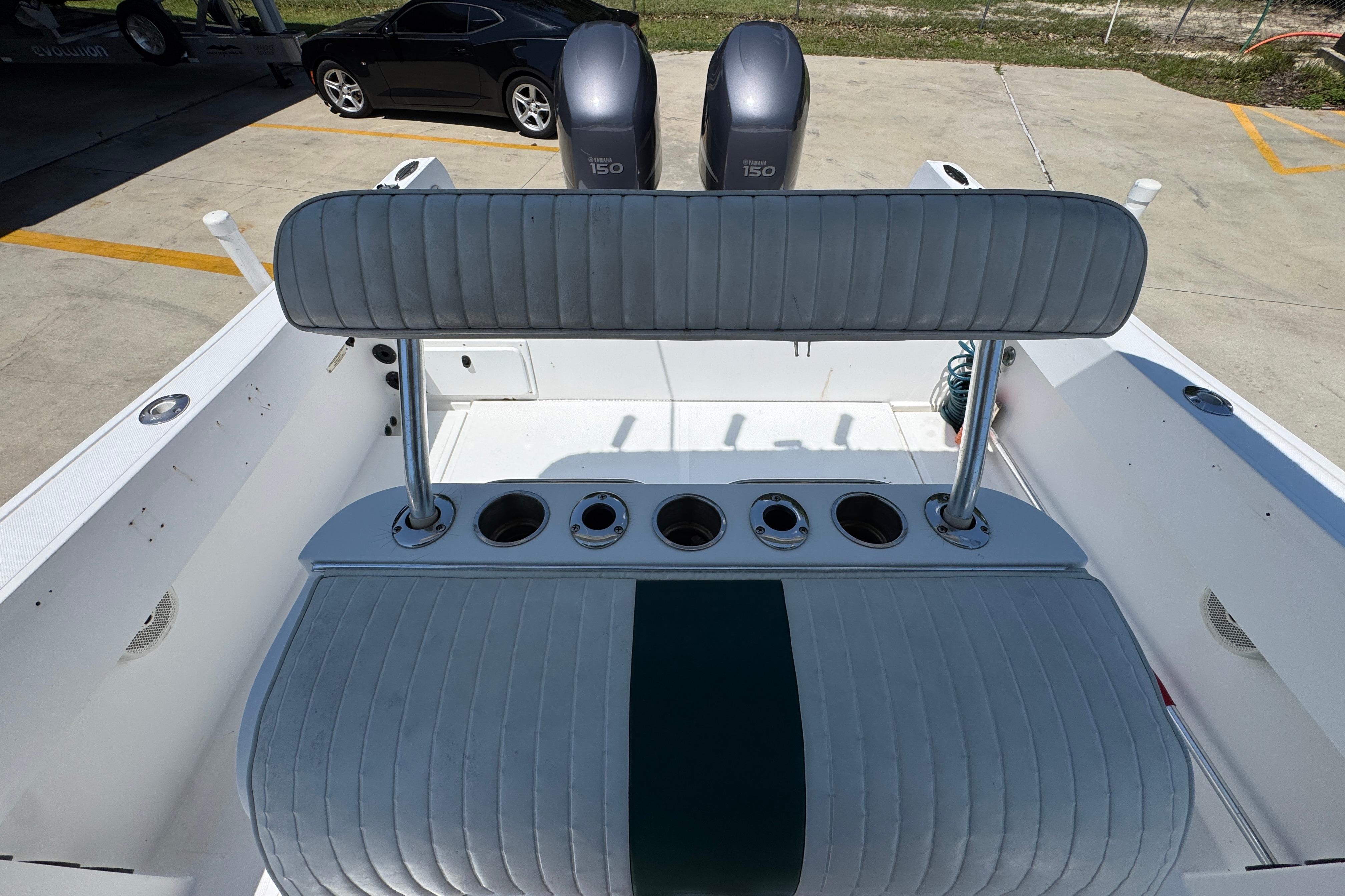 2000 Stamas 250 Tarpon boat interior with seating and dual outboard engines.