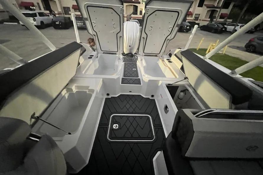 2022 Cobalt R6 Outboard boat interior with open storage compartments and sleek design.
