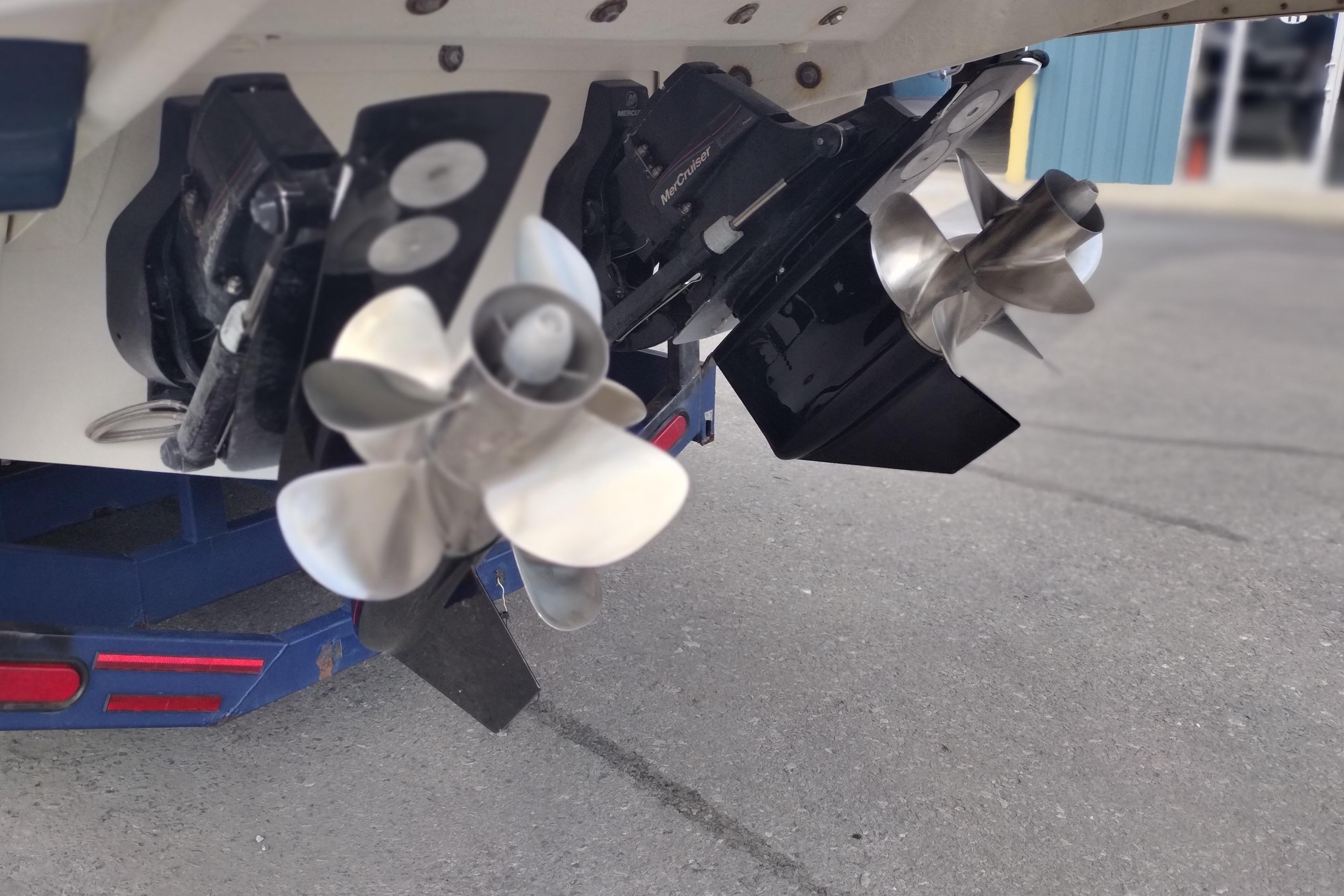 Propellers of a 2013 Sea Ray 300 SLX boat on a trailer.