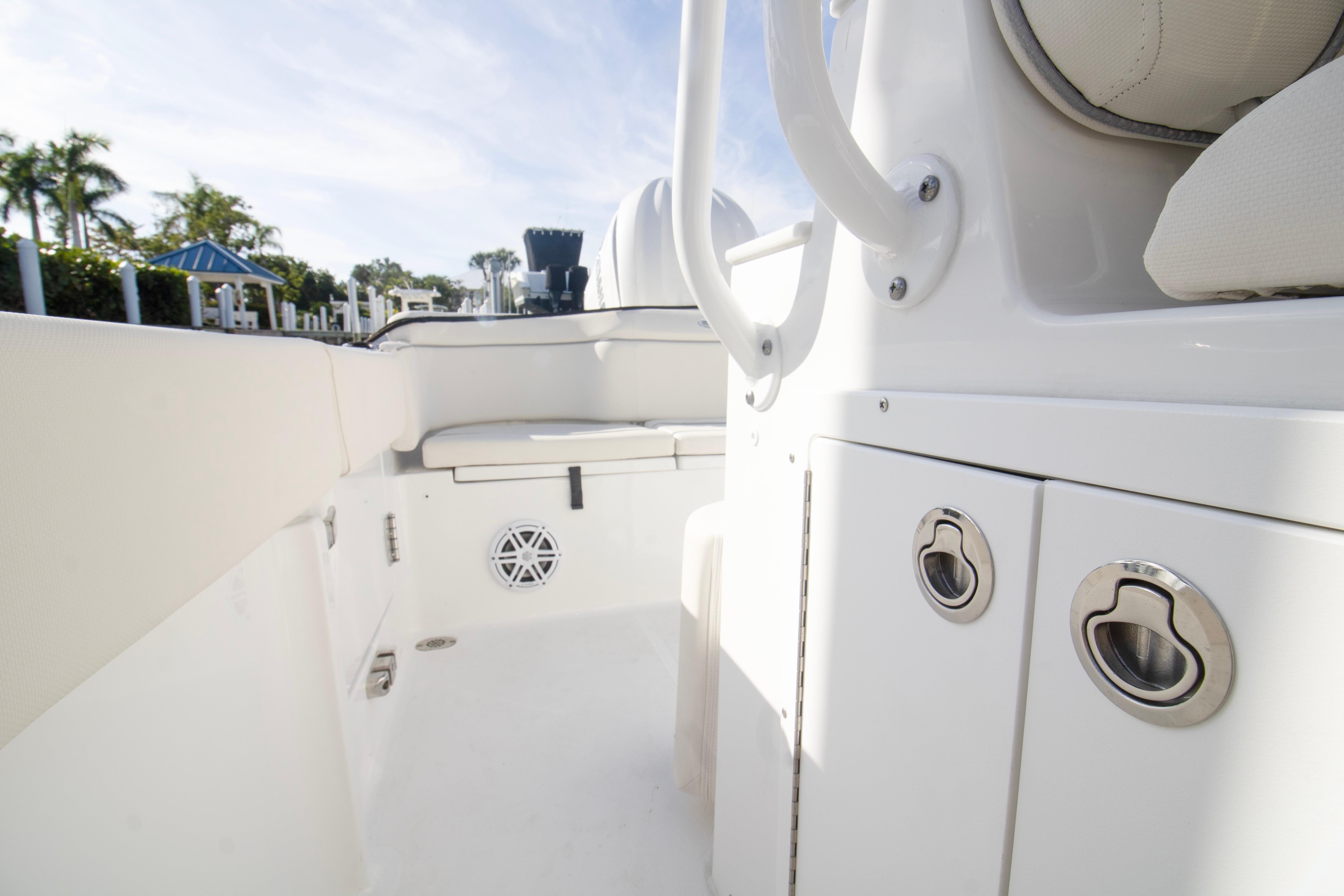 2026 Sea Hunt Ultra 245 SE boat interior with seating and storage compartments.