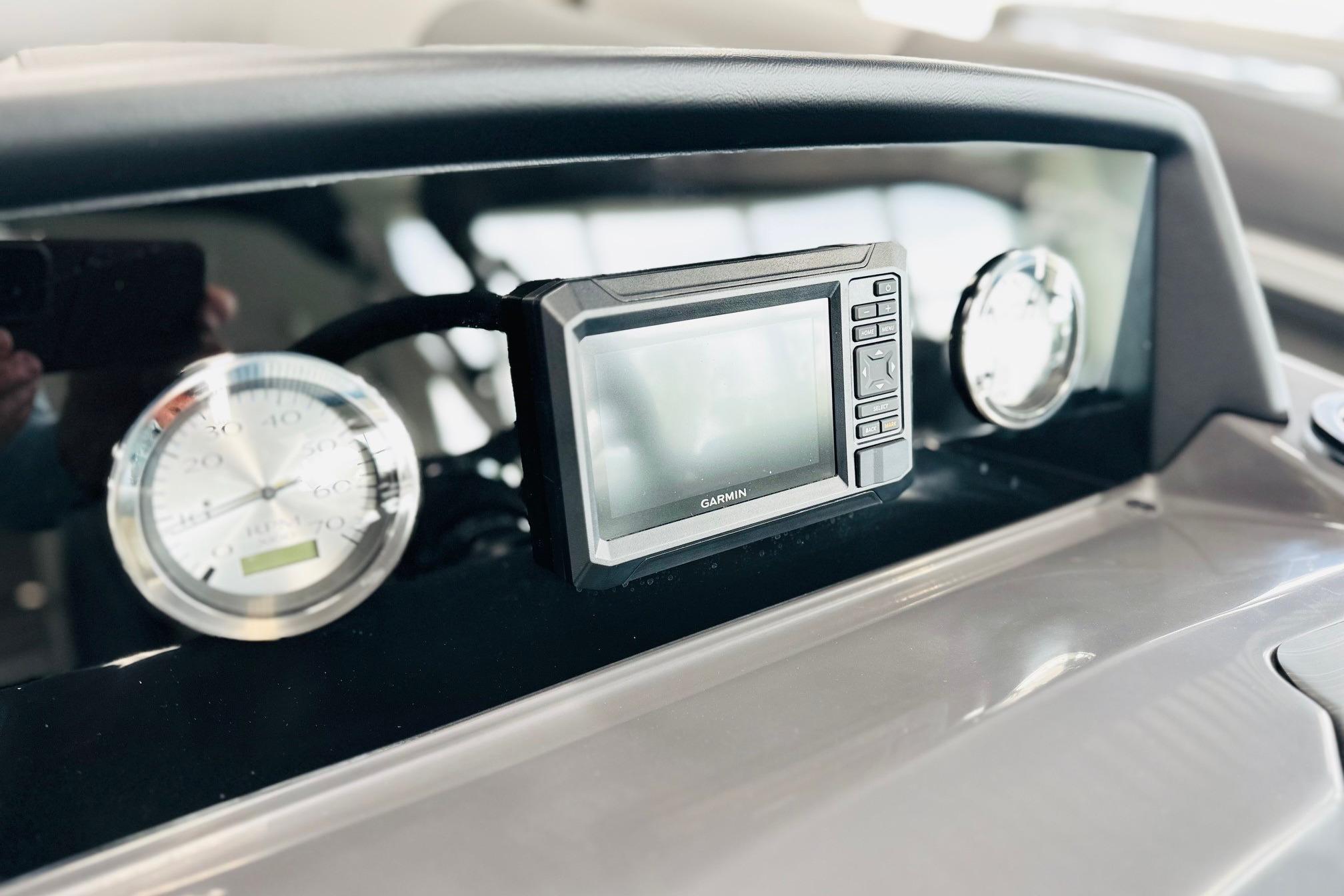 Dashboard of 2026 Bennington 22 SSR with Garmin display and gauges.