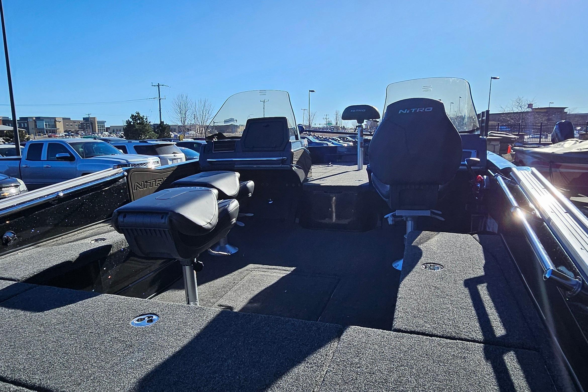 2025 Nitro ZV20 boat interior with seating and dashboard, parked outdoors.