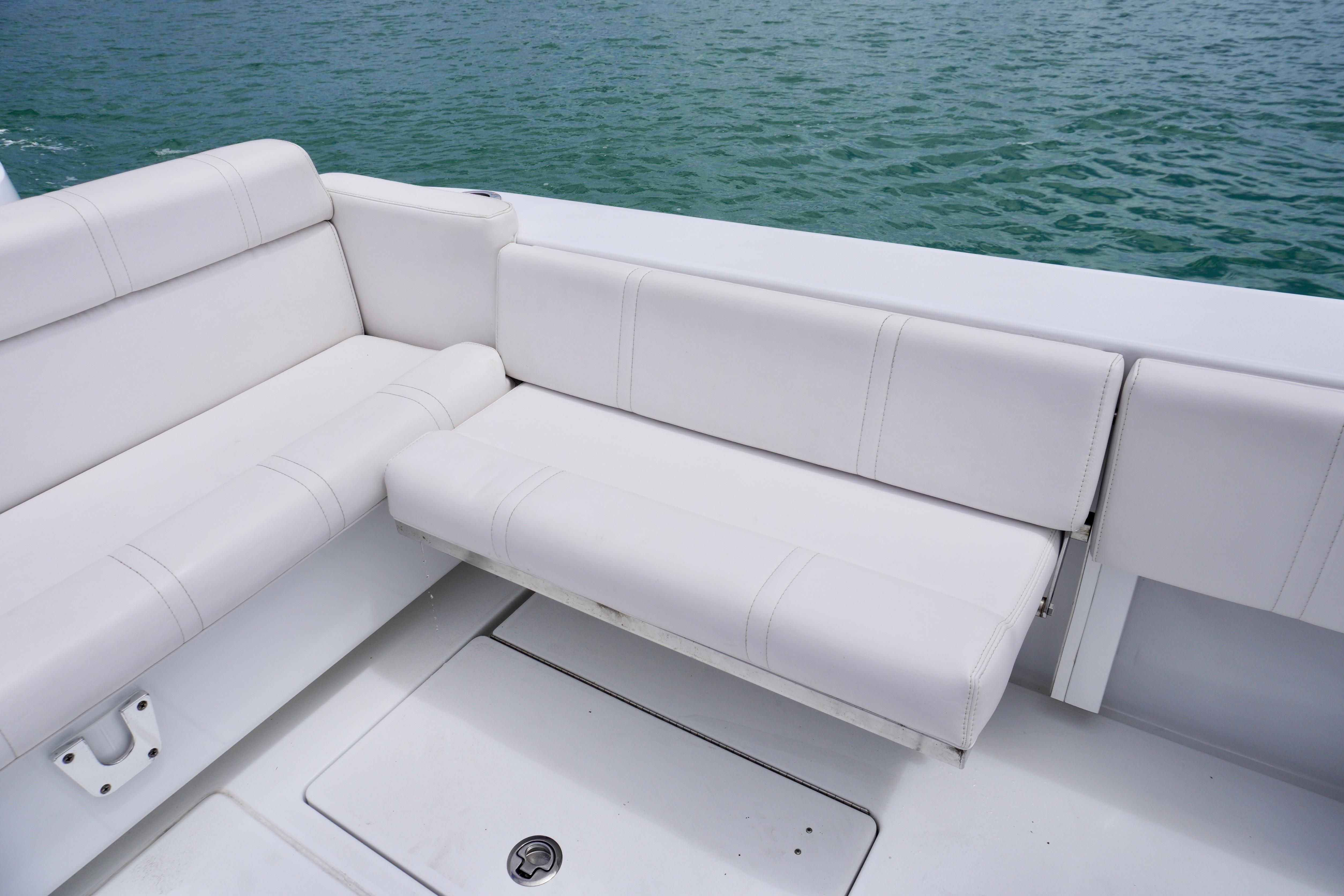 White seating on 2013 Contender 35 LS boat, overlooking calm water.
