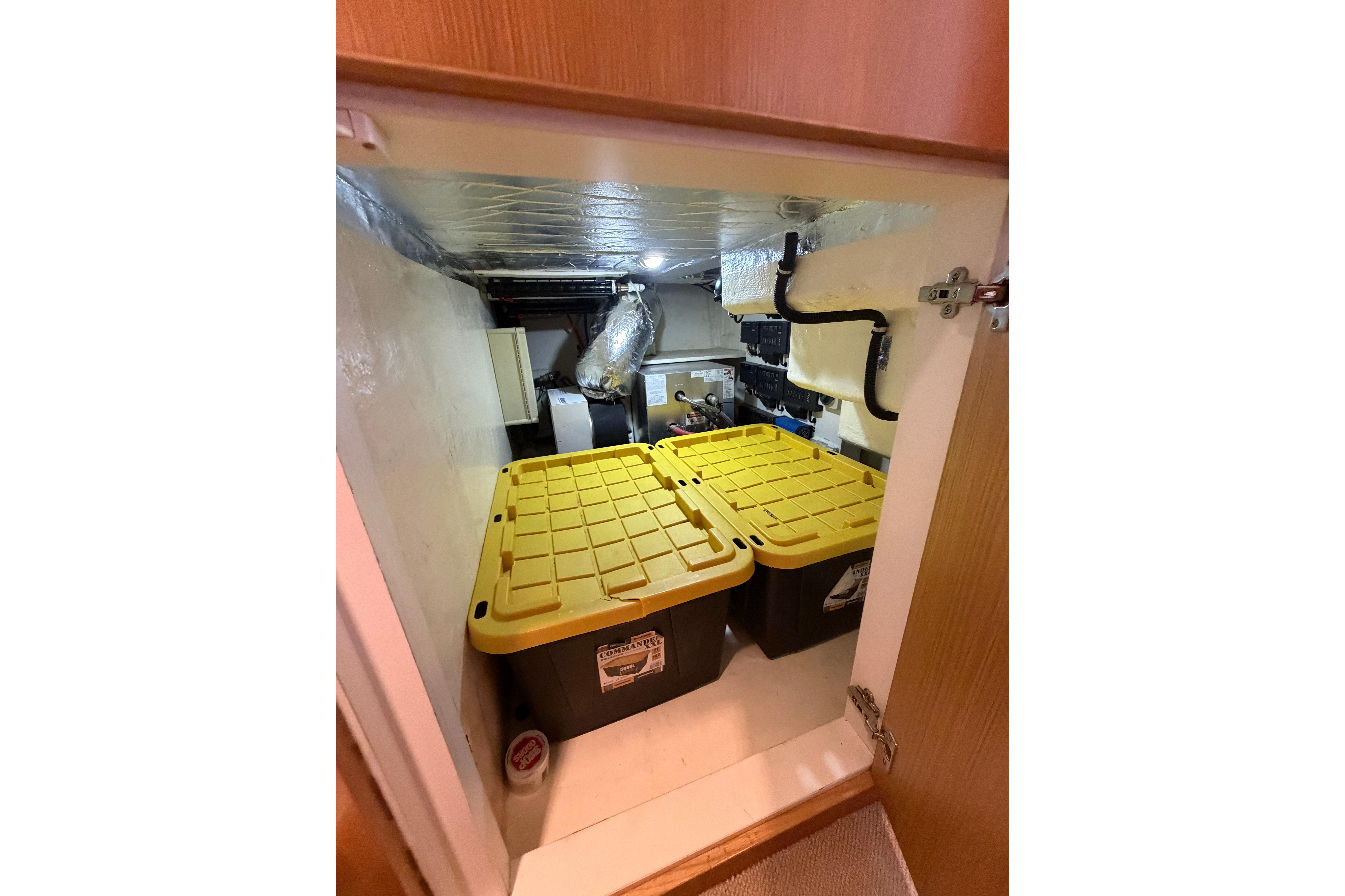 Storage compartment in guest room with mechanical access