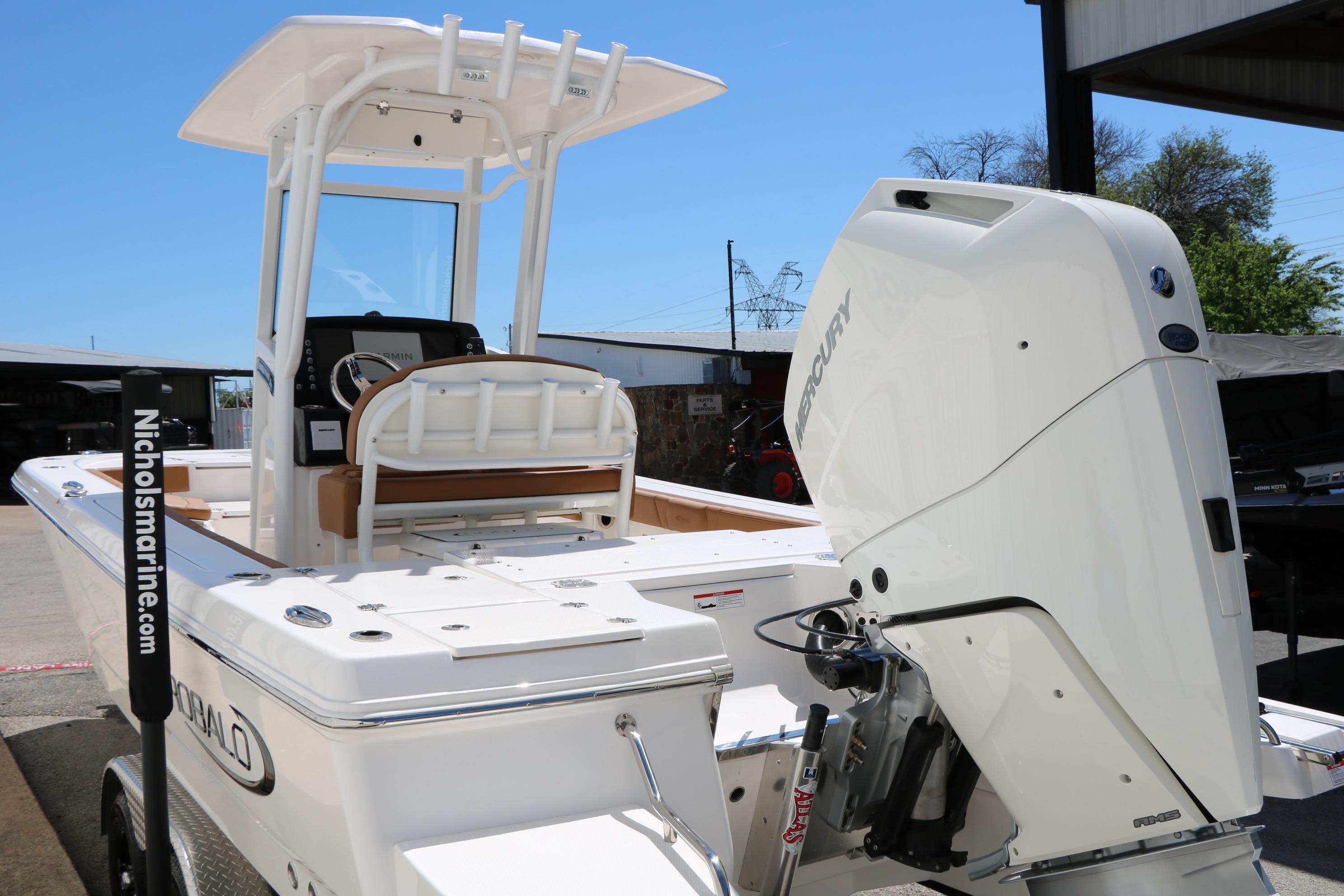 2026 Robalo 246 Cayman boat with Mercury engine, docked at Nichols Marine.