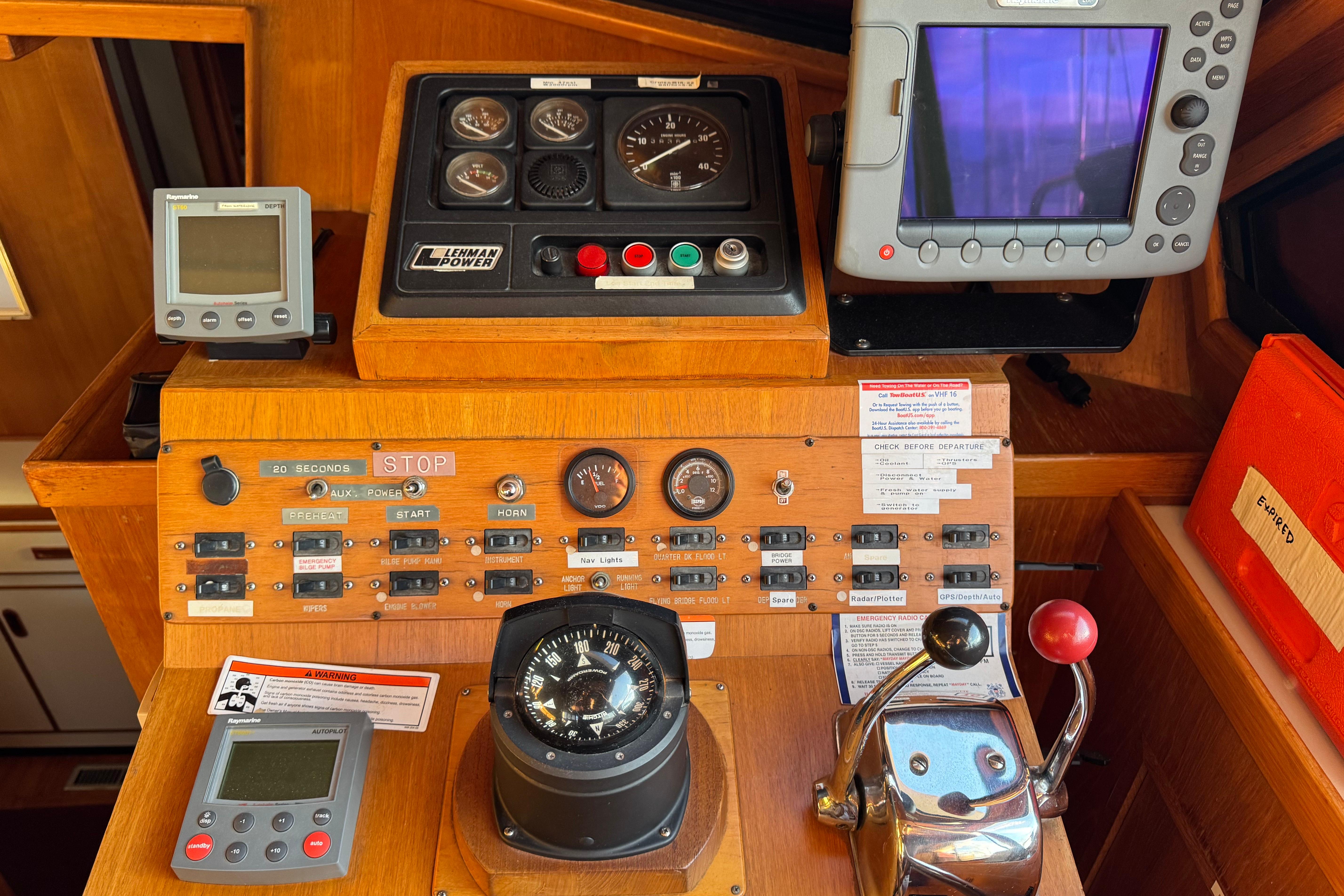 Control panel of a 1987 President 37 boat with navigation instruments.