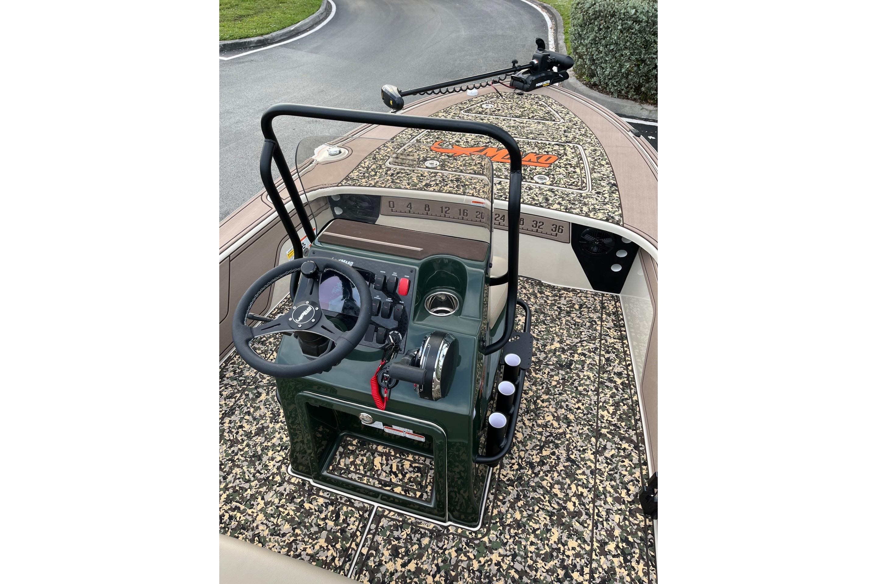 2026 Mako 18 Pro Skiff Backwater Edition with camo deck and steering console.