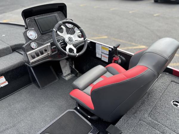 2025 Nitro Z19 Pro boat interior with steering wheel and red-accented seat.