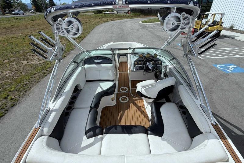 2004 MasterCraft XStar boat interior with white seating and wood accents.